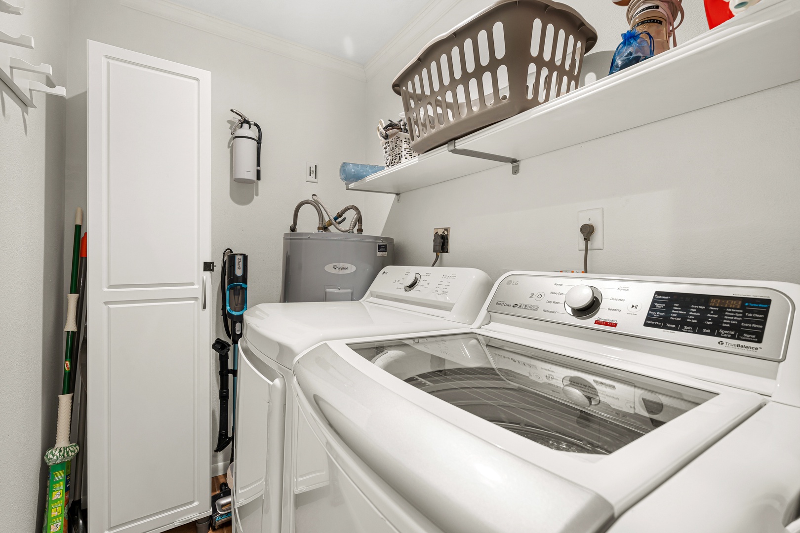 Your dedicated laundry room features modern washing and drying machines, with convenient shelving for supplies and essentials—making it easy to keep your vacation wardrobe fresh.