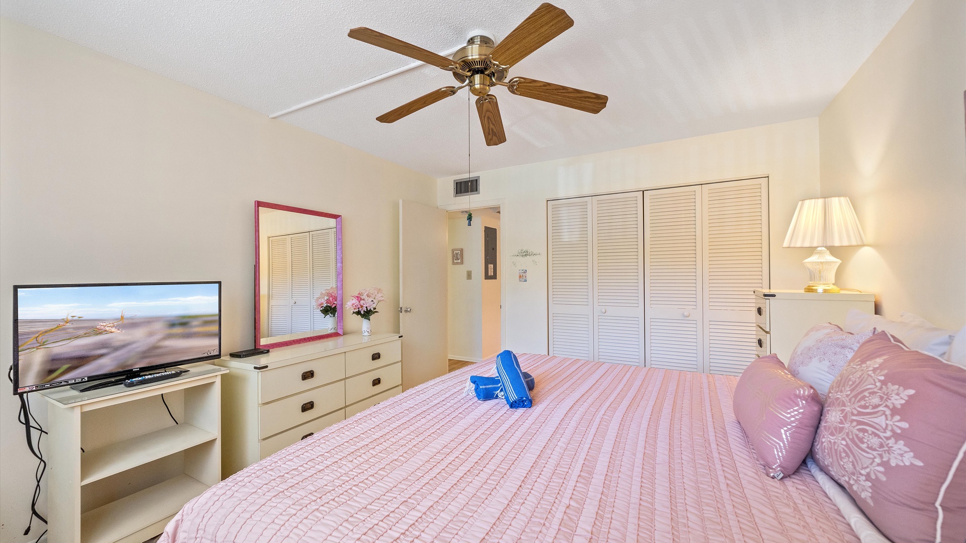 Relax in your bright, comfortable bedroom with a cozy queen bed, ceiling fan to keep you cool, and a flat-screen TV for your favorite shows or movies.
