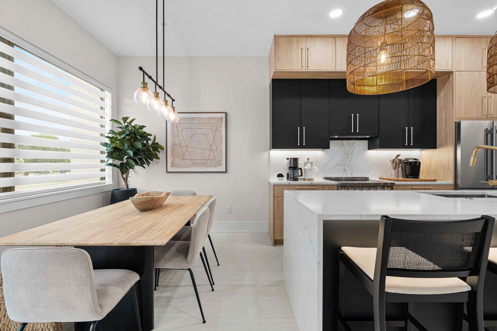 Your modern kitchen awaits with sleek countertops and warm wood finishes, where you'll love preparing meals surrounded by natural light. The open dining space invites memorable gatherings with loved ones.