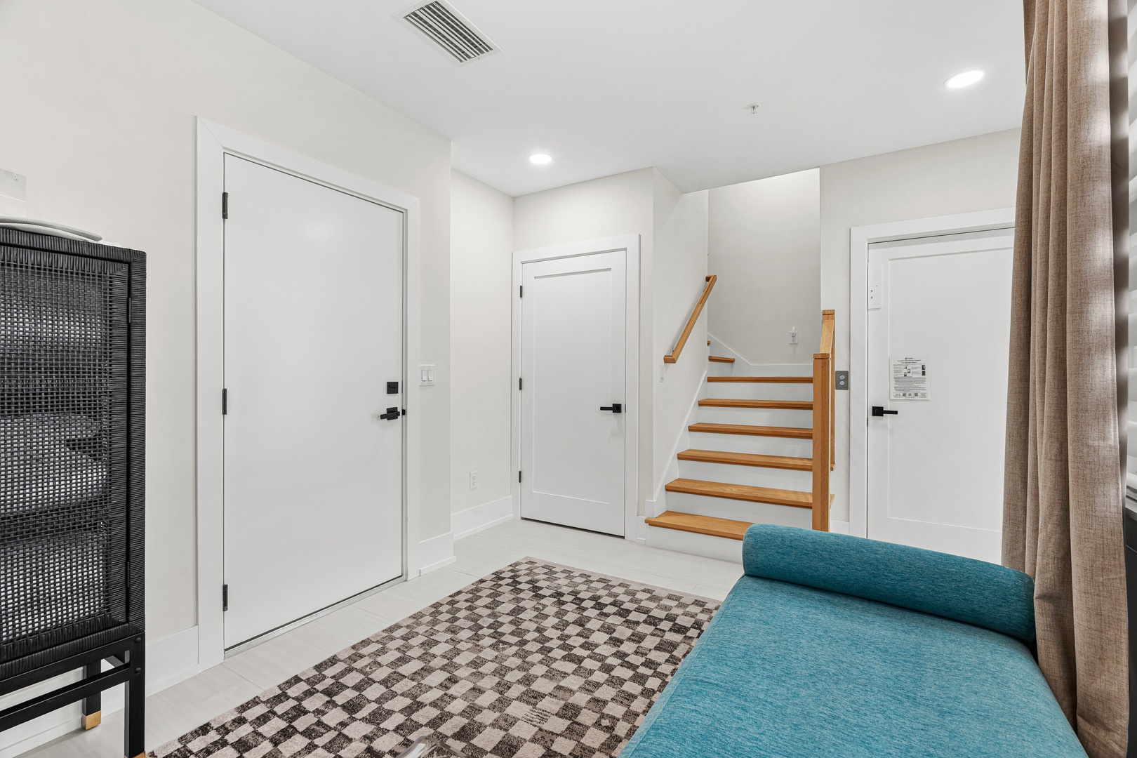 Modern entryway with garage and elevator access.