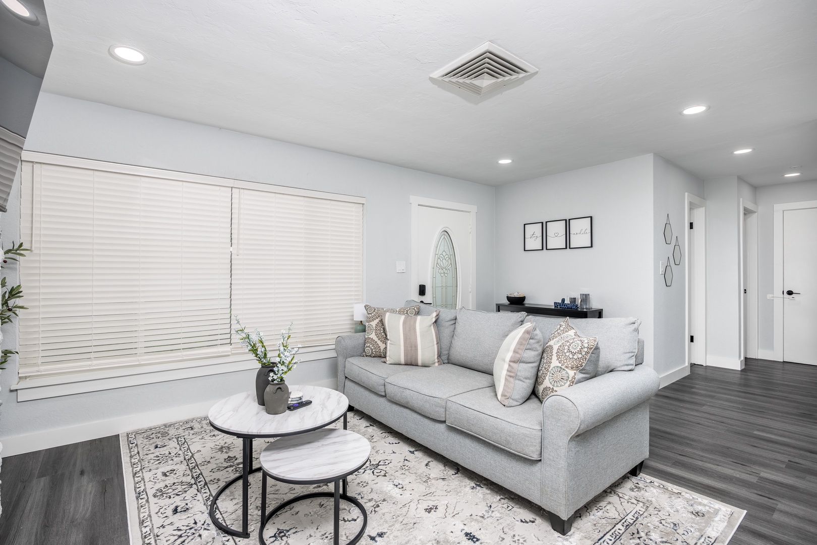 Settle into this beautifully designed living room where modern comfort meets elegant style, perfect for your relaxation after exploring.