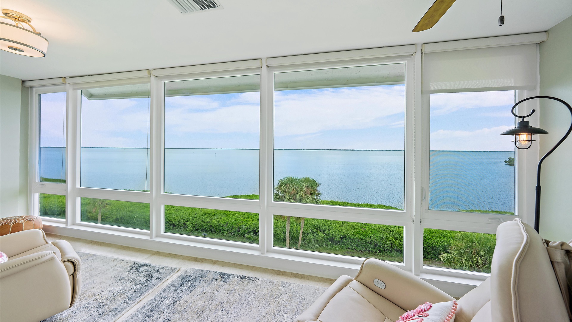 Sarasota Bay fills the sunroom windows, with mangroves and open water stretching across the view. A peaceful waterfront backdrop that gives this penthouse its unmistakable sense of place.