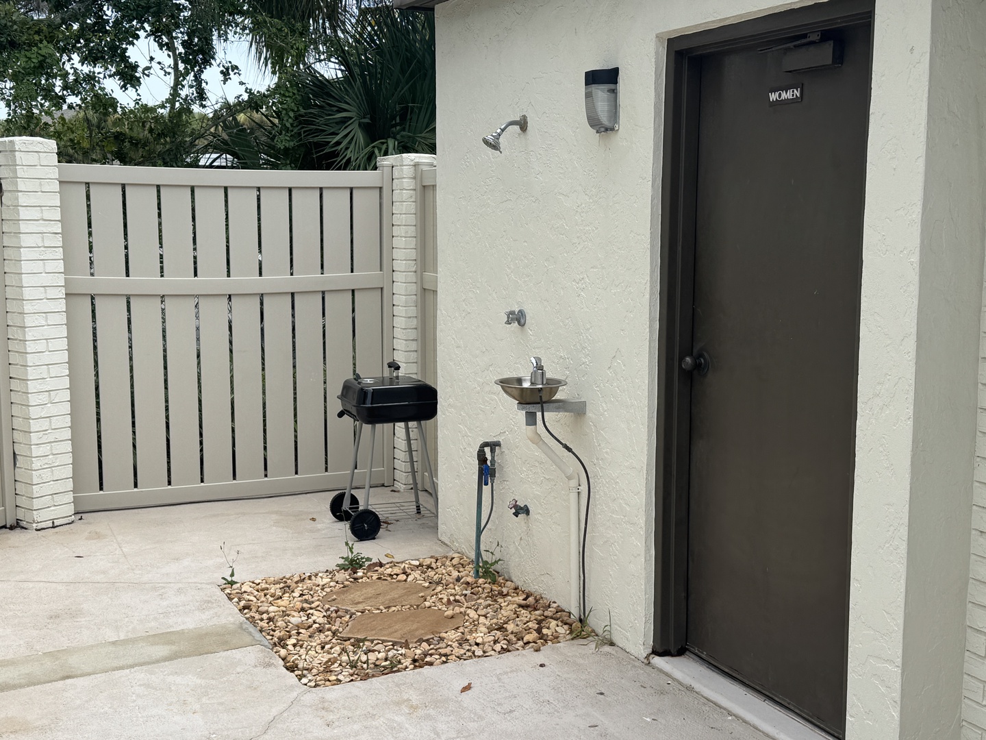 Enjoy cooking burgers or fish on the small community charcoal grill in the pool area.