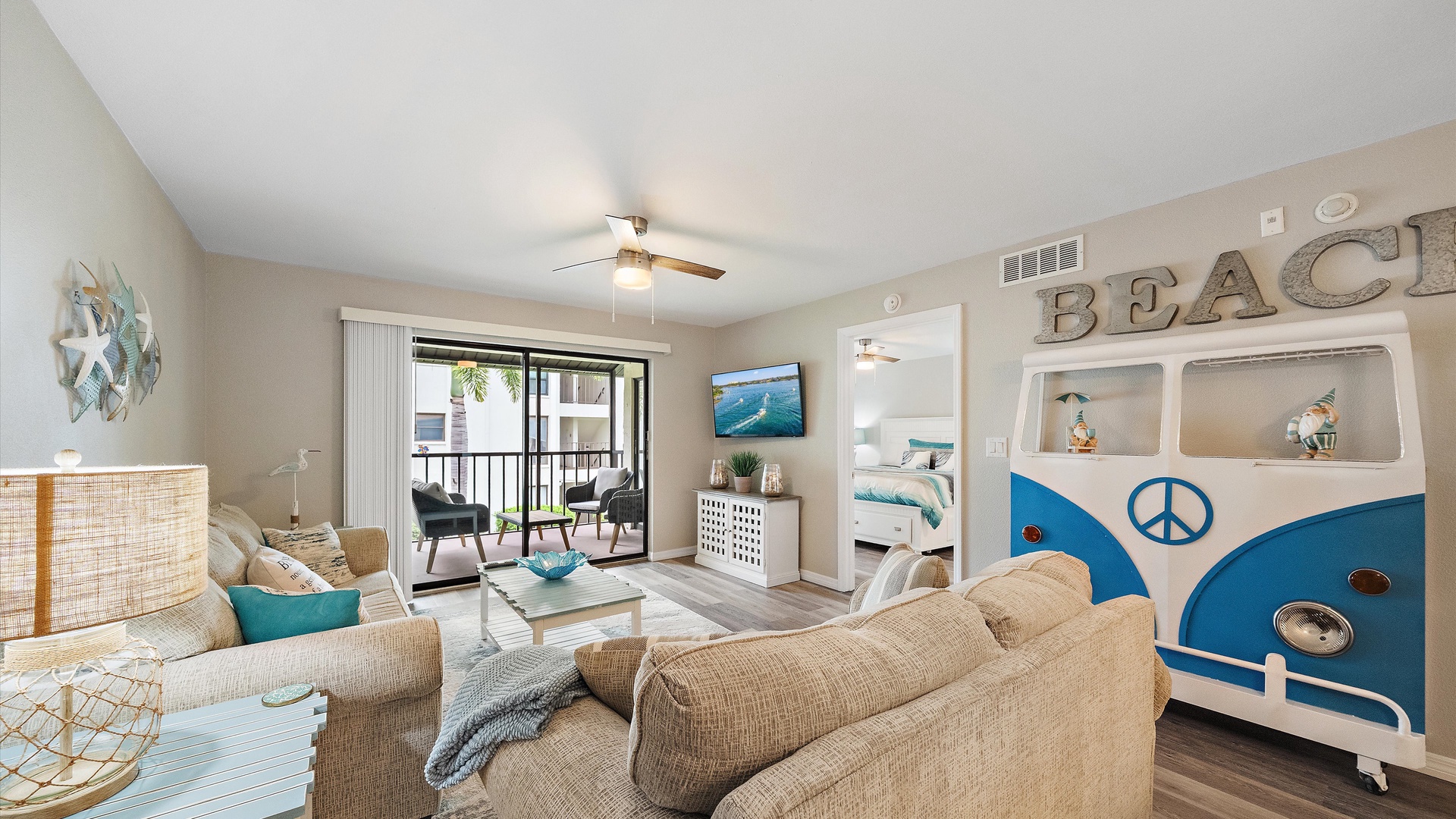 Relax in your bright, beachy living space with cozy seating, coastal décor, and a private balcony perfect for morning coffee or evening sunsets.