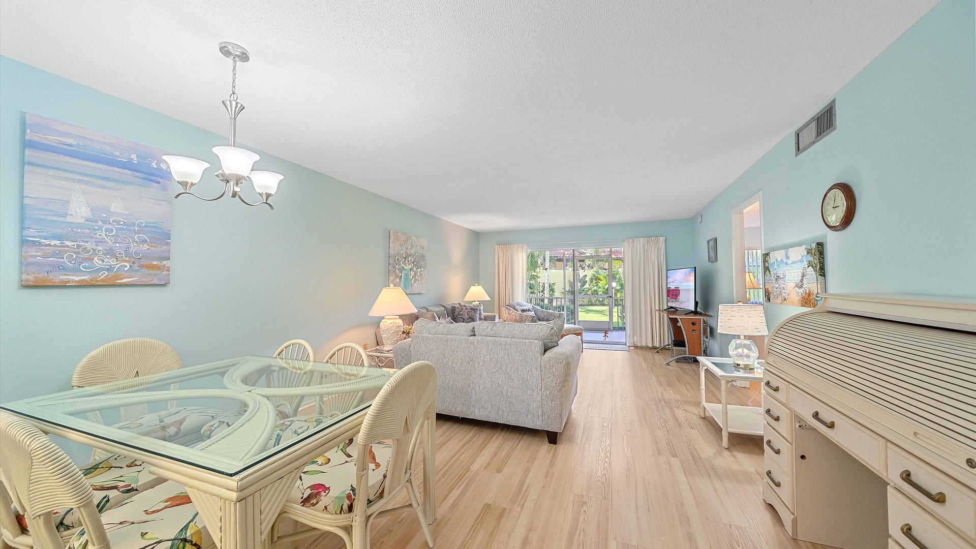 Picture yourself unwinding in this sun-filled space with coastal décor and easy patio access, perfect for breezy mornings and relaxed evenings with loved ones.
