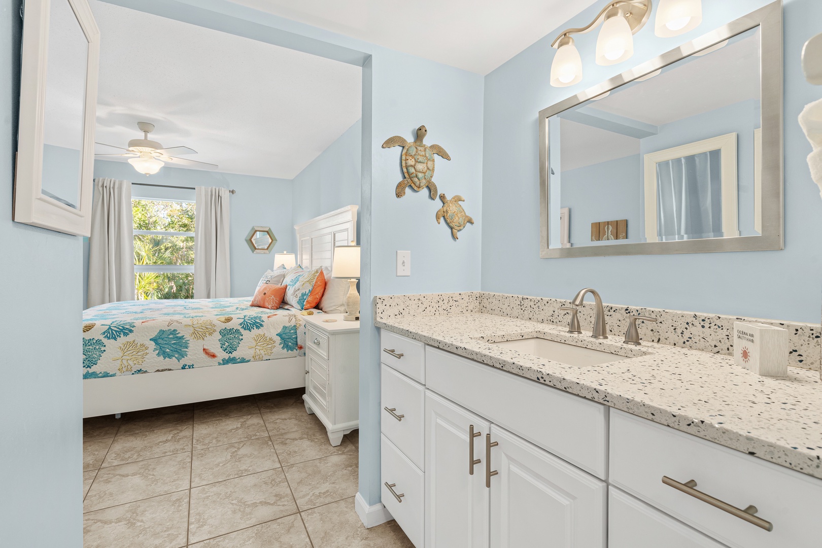 Well-lit ensuite bathroom with plenty of counter space and plush bath towels for your stay.