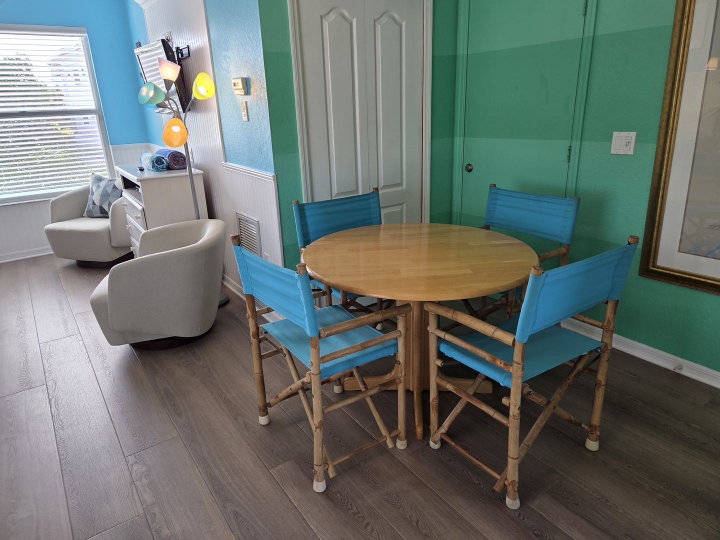 Step into your bright, coastal retreat where a cheerful dining table and comfortable seating await your morning coffee or evening card games. The cheerful blue and turquoise palette instantly puts you in vacation mode.