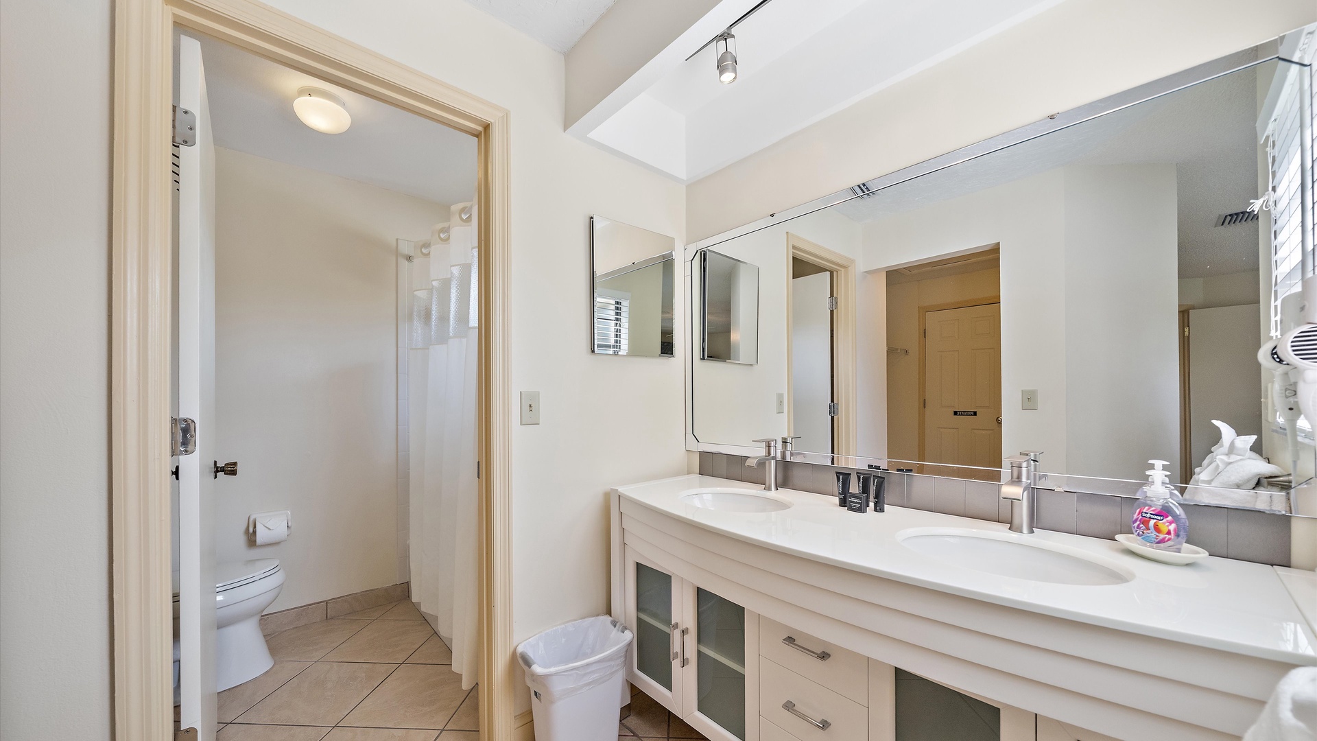 Freshen up in your spacious bathroom with dual sinks, ample counter space, and a walk-in shower—perfect for getting ready for your day of adventure.