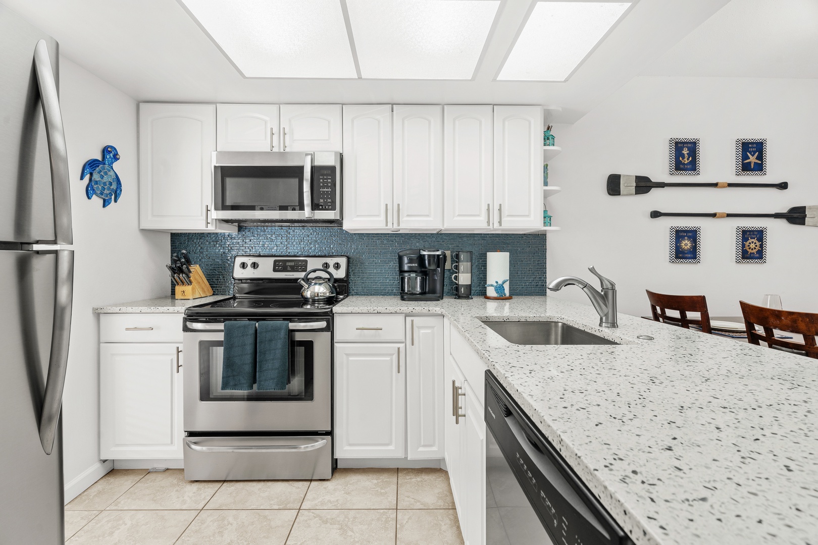 Your bright, fully-equipped kitchen awaits - perfect for at-home meals with family and friends looking for a memorable beach vacation.