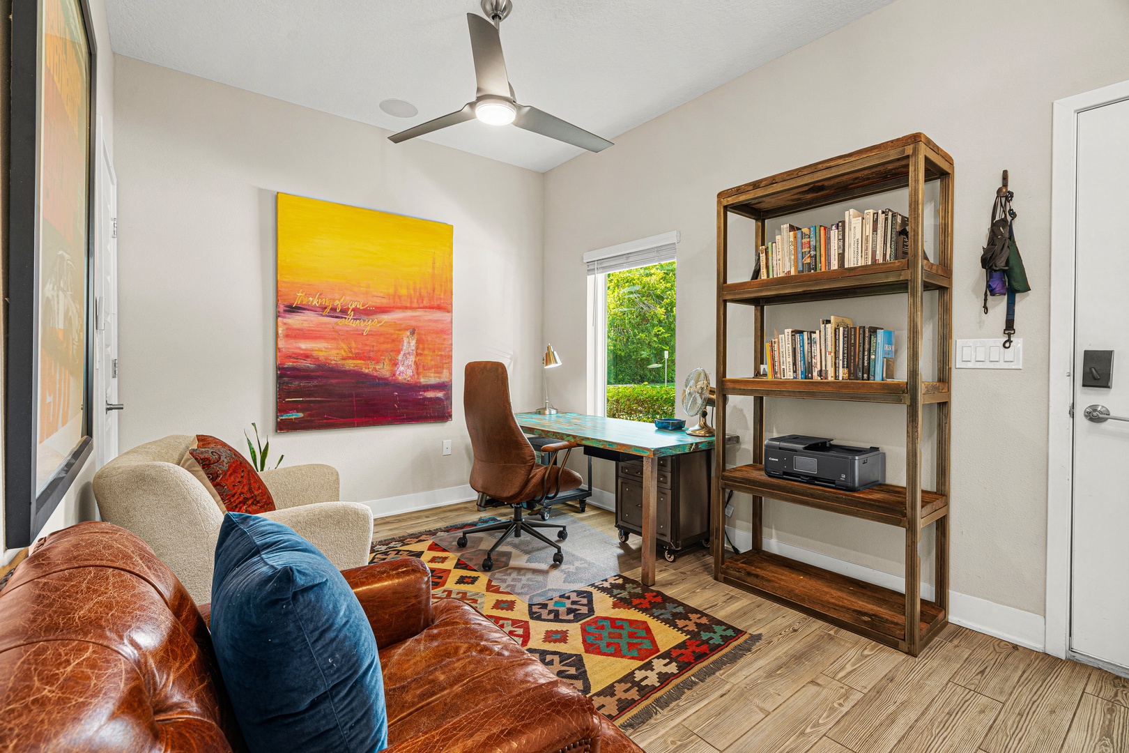 Work comfortably from your dedicated desk space, where natural light and breezy comfort from the ceiling fan create your perfect productivity spot.