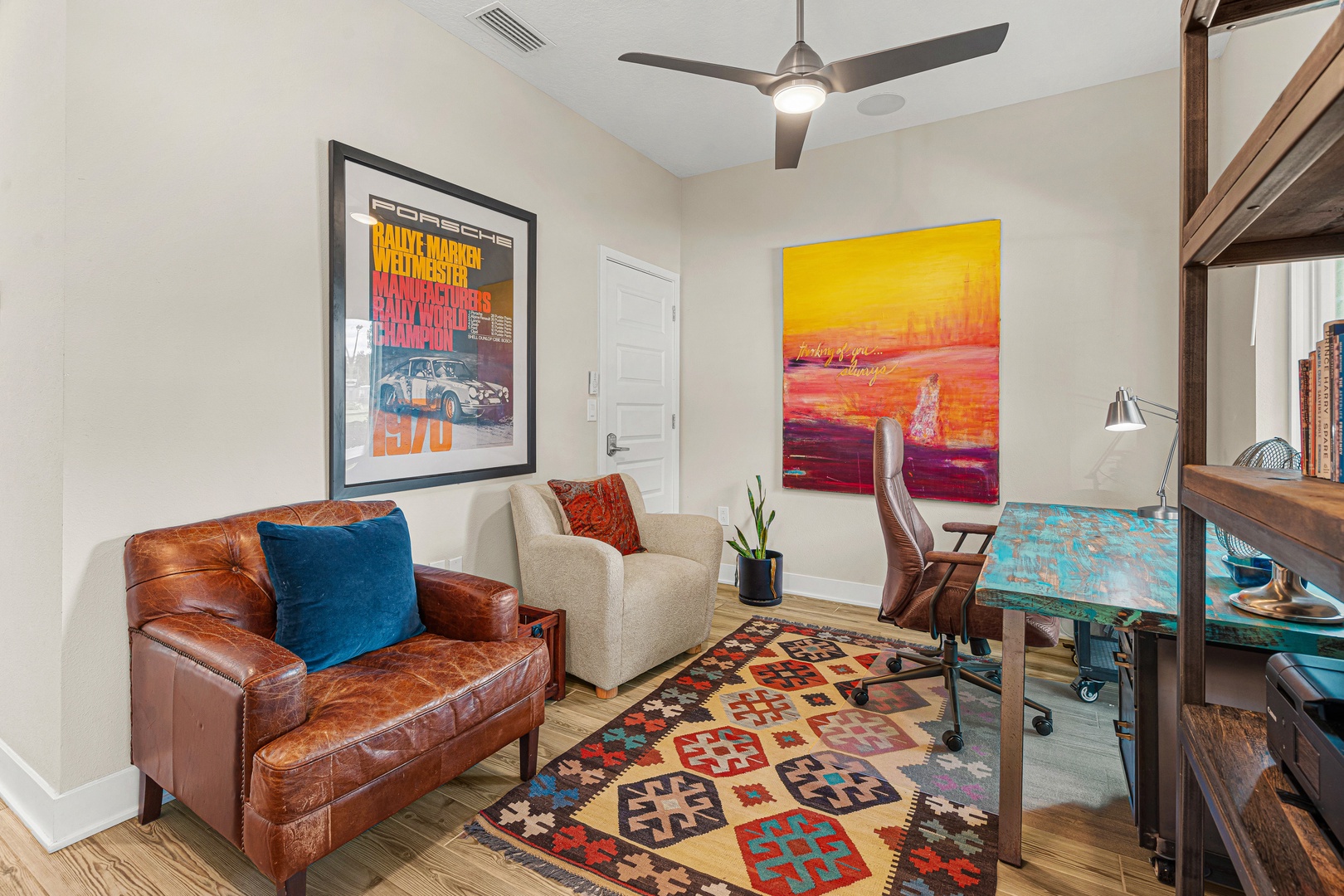 Settle into your personal workspace, where a stylish leather chair and vibrant art create an inspiring atmosphere. Natural light and modern touches make this the perfect spot to check emails or plan your adventures.