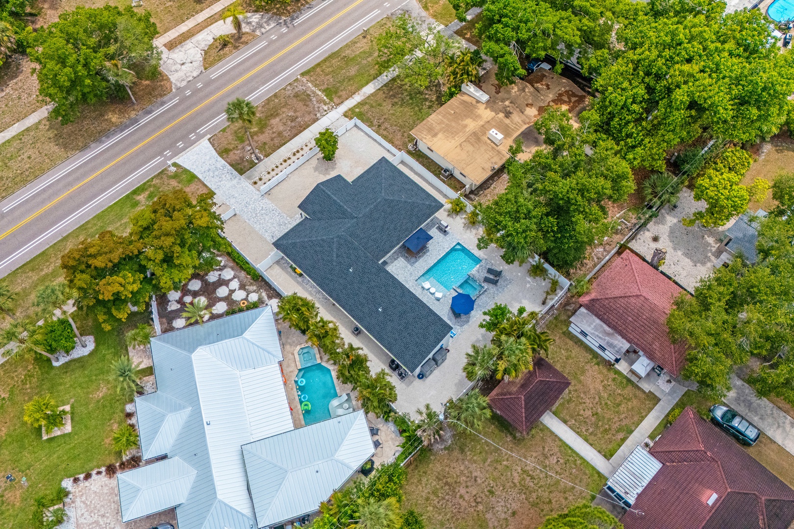 Aerial view of the home in a peaceful residential neighborhood.