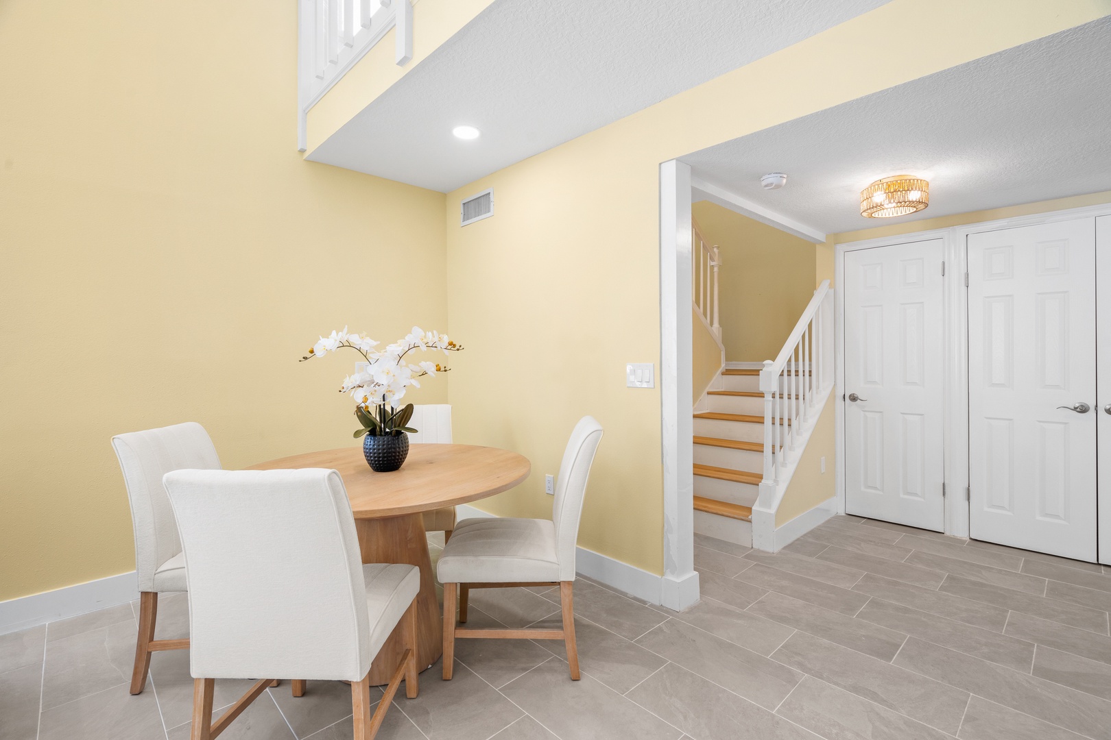 Gather around your elegant dining table for memorable meals in this bright, welcoming space with beautiful warm tones and modern touches.