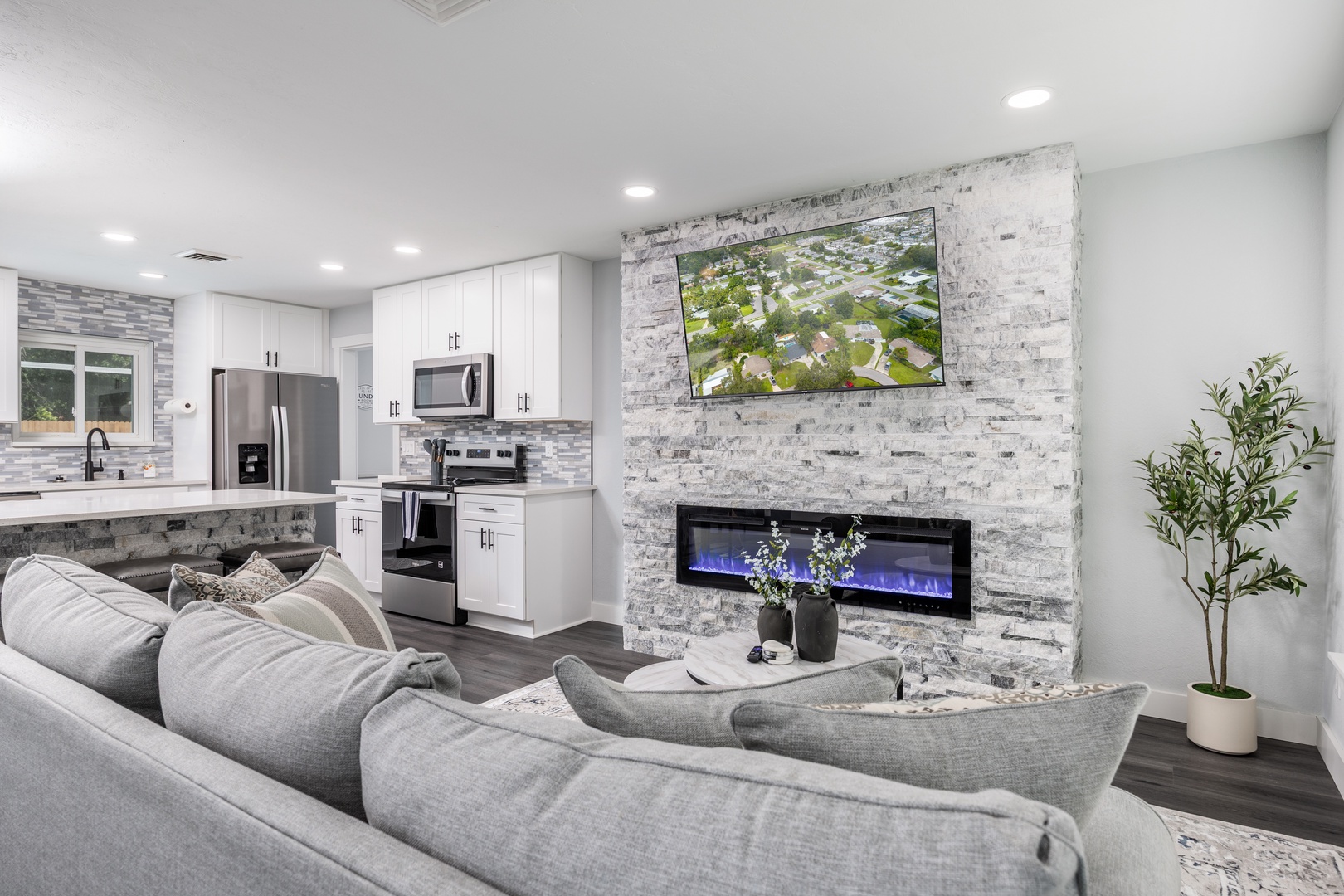 Sink into plush seating while your fireplace creates a cozy ambiance and the fully equipped kitchen awaits your culinary adventures.