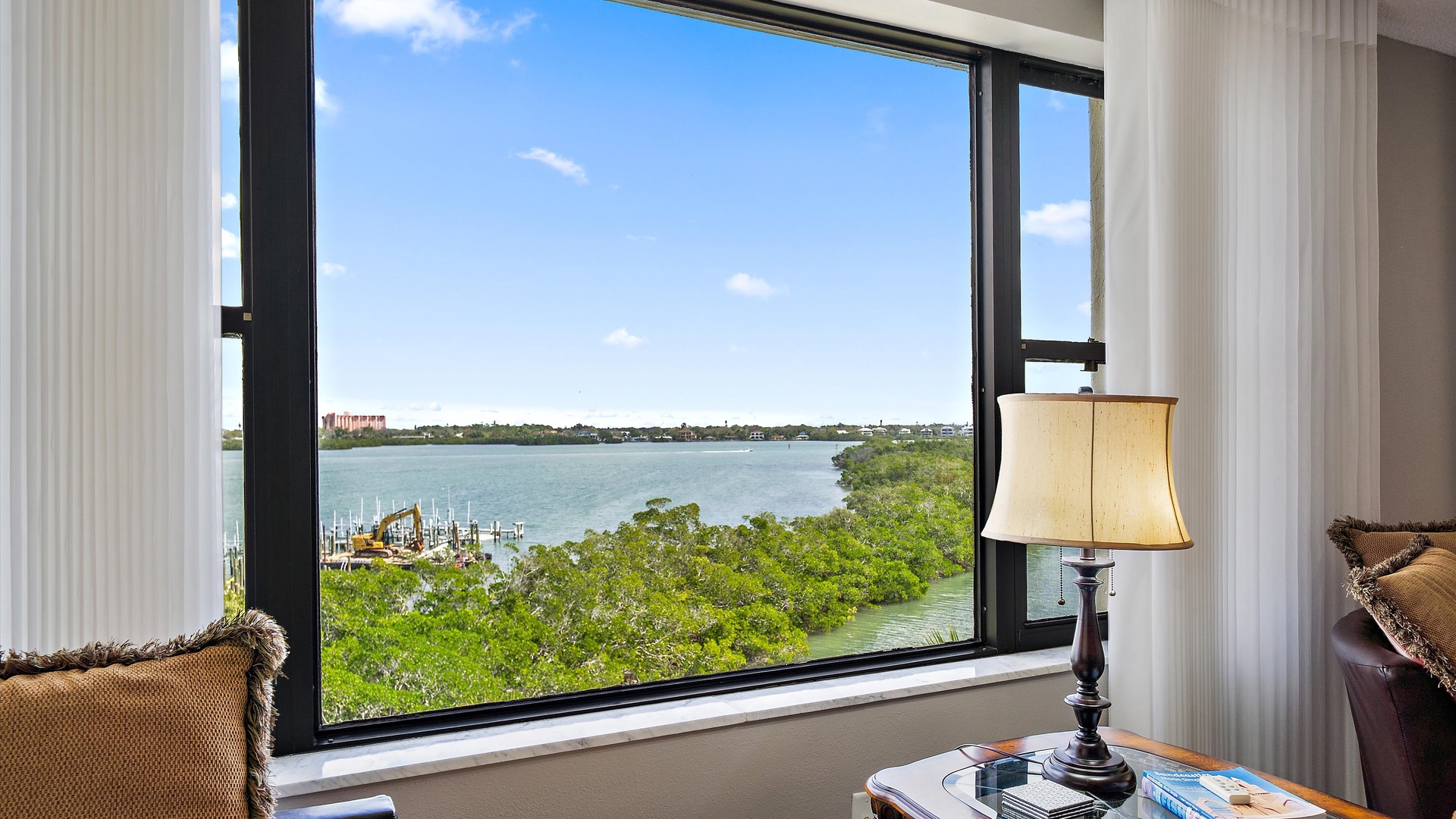 Unwind by your window while soaking in breathtaking lake views and peaceful marina scenery.