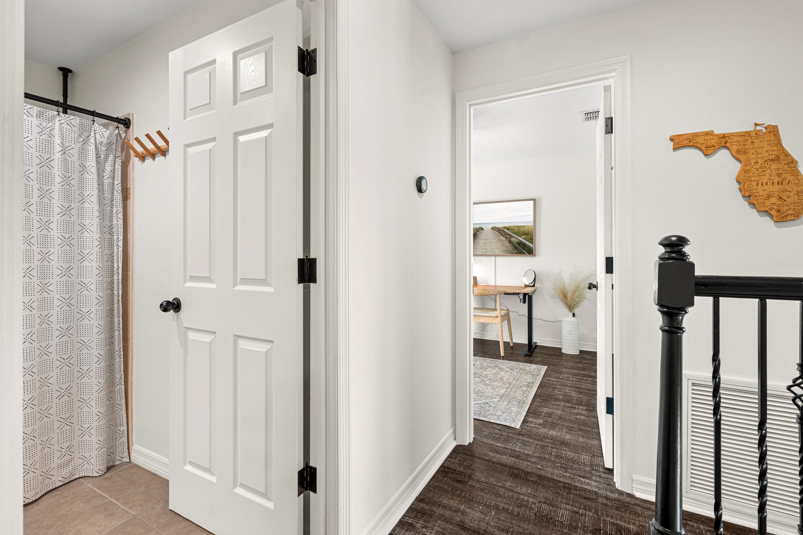 Welcome to your cozy coastal retreat! Step inside and feel instantly at home in this bright, airy hallway where beachy vibes meet modern comfort.