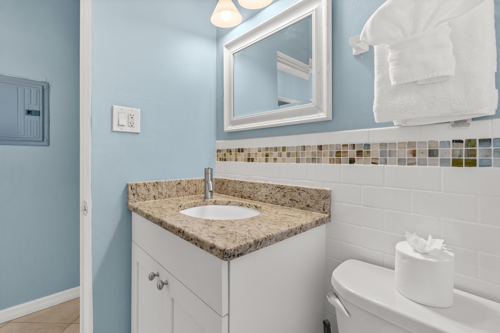 Your private bathroom features granite countertops, shower tub combo, plush bath towels, and starter essentials for your stay.