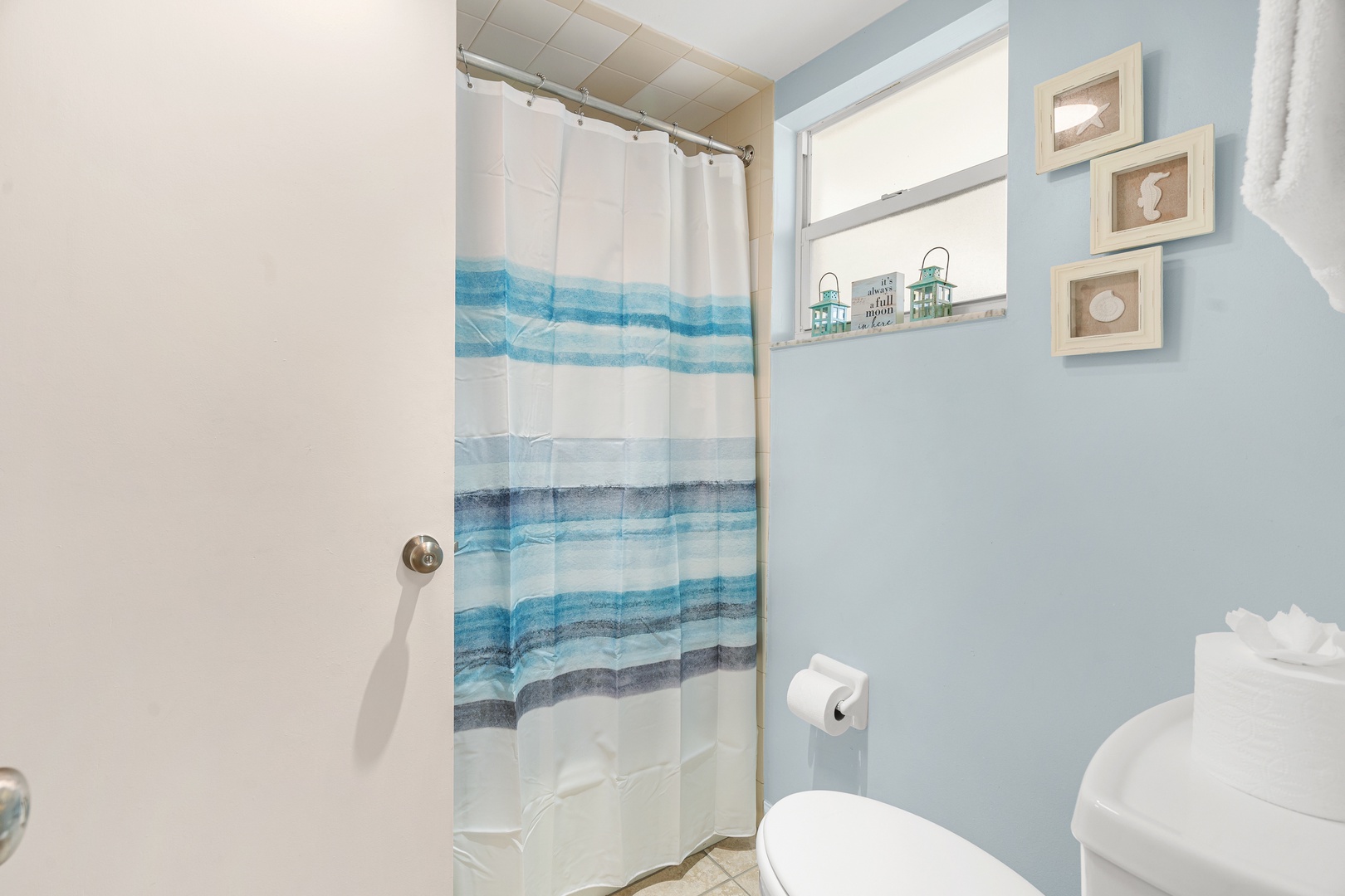 Ensuite bathroom with shower tub combo and private access.