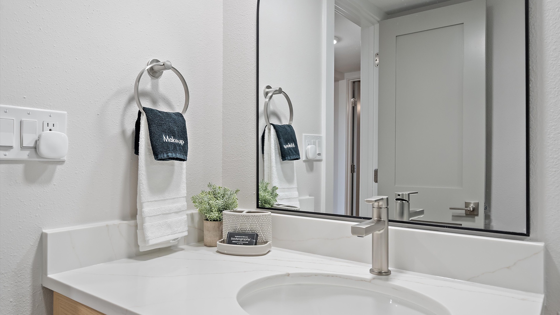Refresh in your thoughtfully appointed bathroom featuring pristine marble countertops, premium fixtures, and thoughtful amenities.