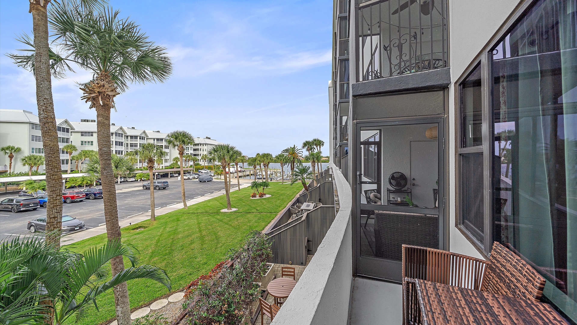 Step out onto your private balcony and take in the coastal town atmosphere with palm-lined streets and nearby beach access just moments away.