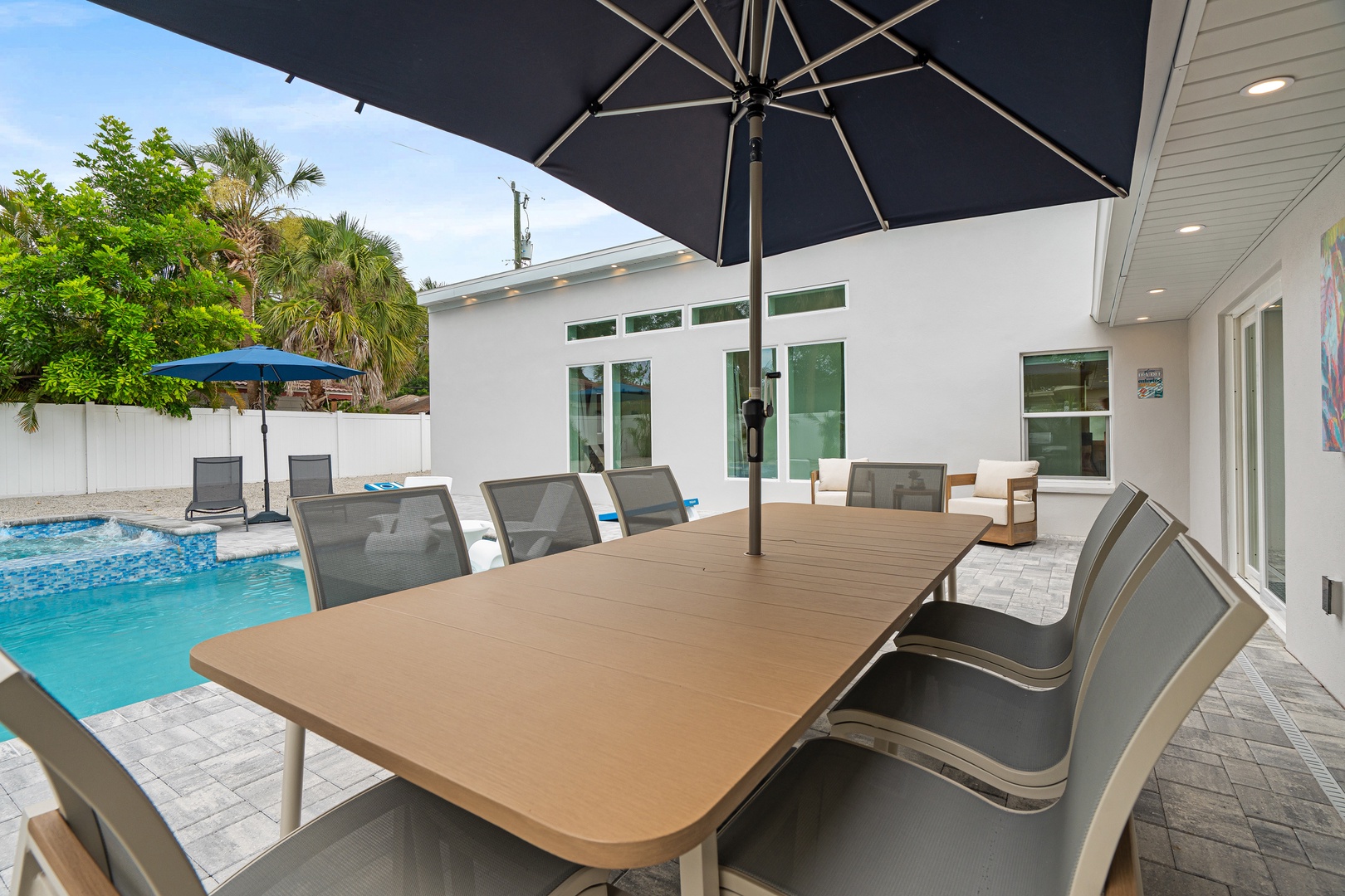 Your private poolside oasis awaits—gather under the shade for al fresco meals, tropical breezes, and sunny Florida moments with loved ones.
