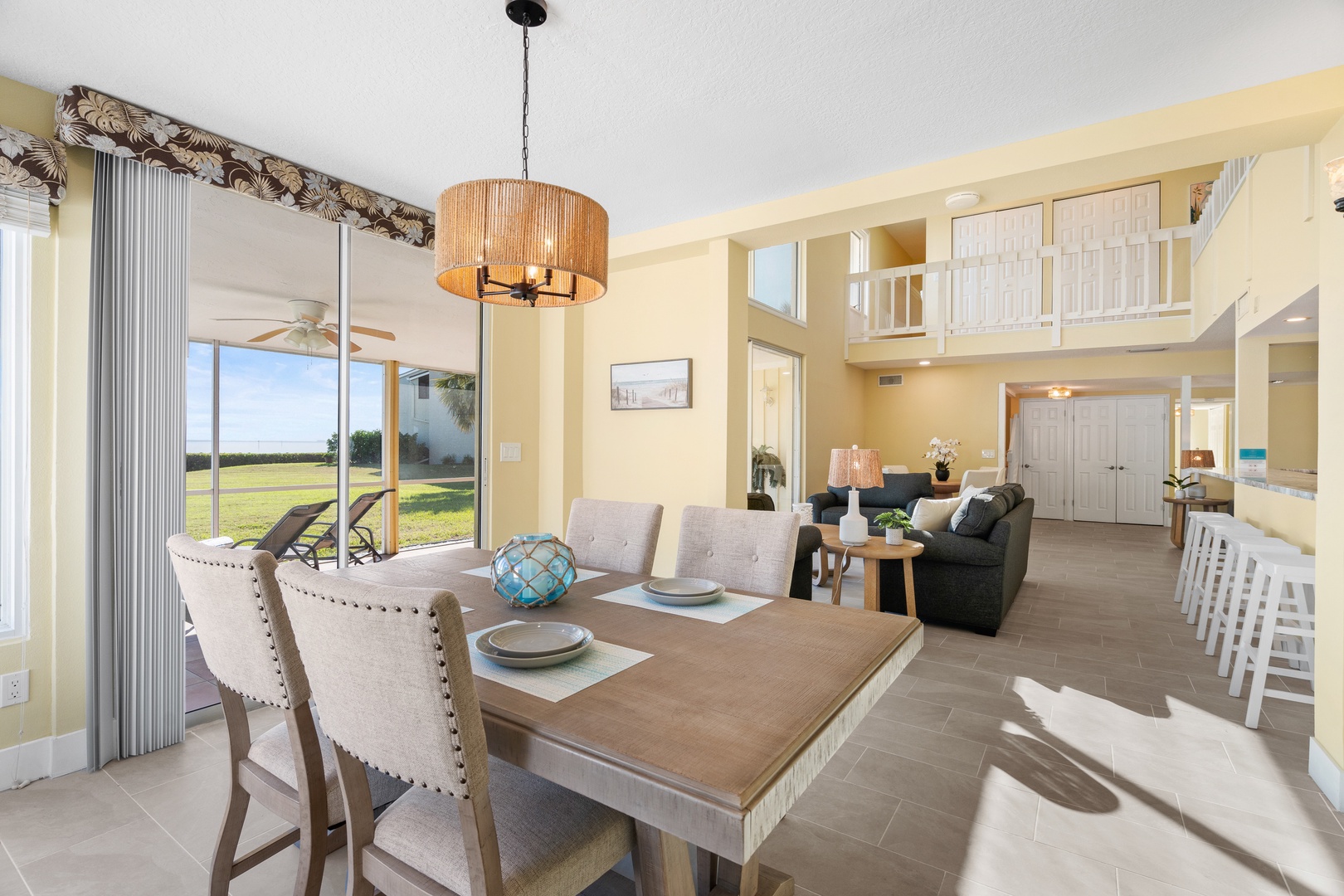 Gather around your beautiful dining table in this bright, open-plan space where natural light floods through large windows overlooking peaceful fields.