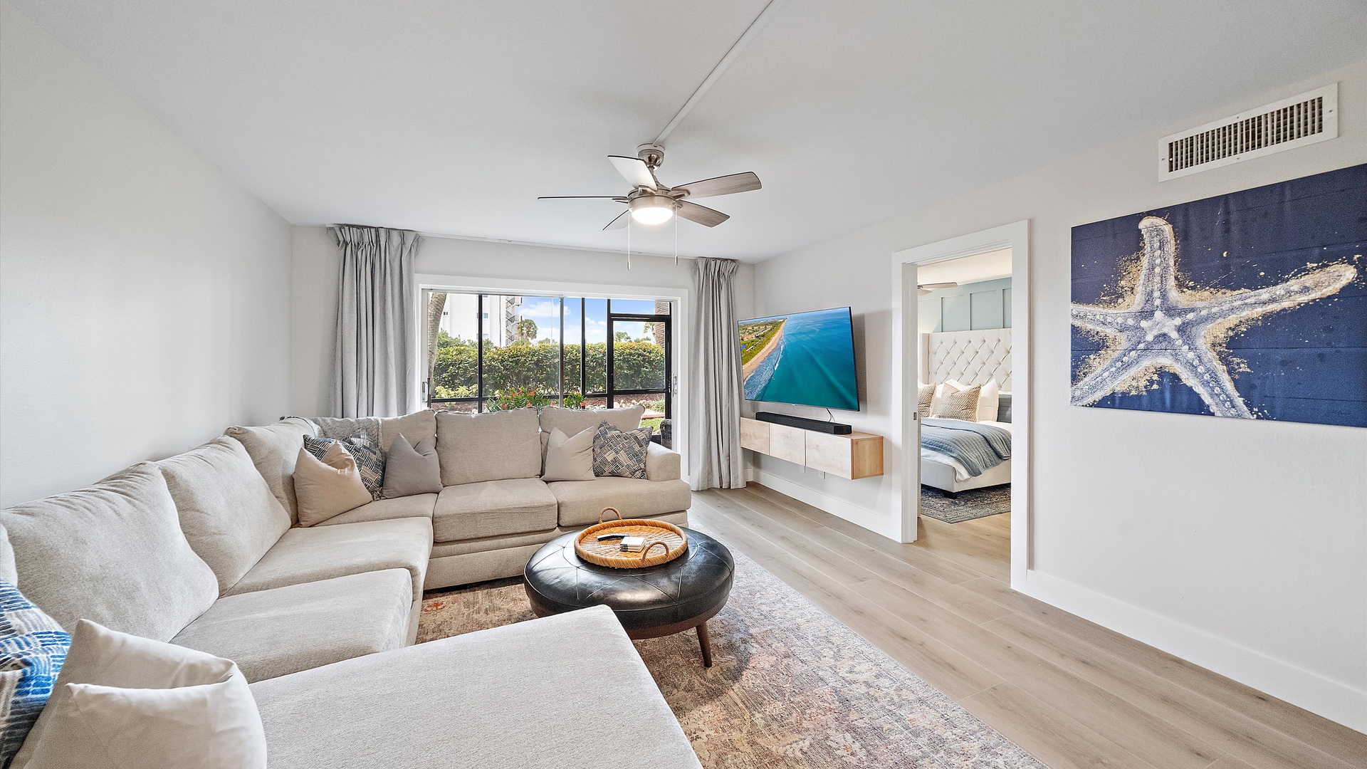 Sink into the plush sectional sofa and enjoy your coastal sanctuary with modern amenities and calming ocean-inspired decor.