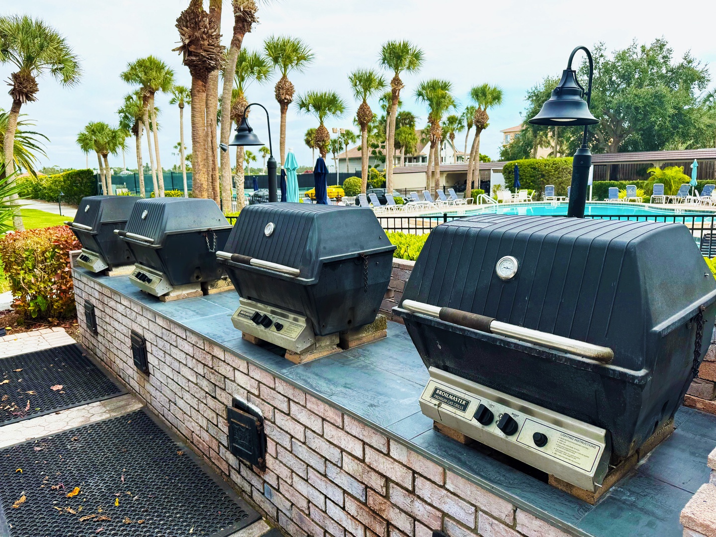 Fire up your poolside feast at these convenient BBQ stations, perfectly positioned near palm trees and crystal-clear waters for unforgettable outdoor dining.