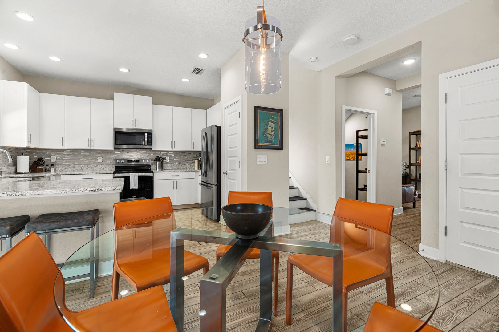 Gather around your dining table for meals with friends and family, with the bright, modern kitchen just steps away. The open layout invites conversation and makes hosting feel effortless.