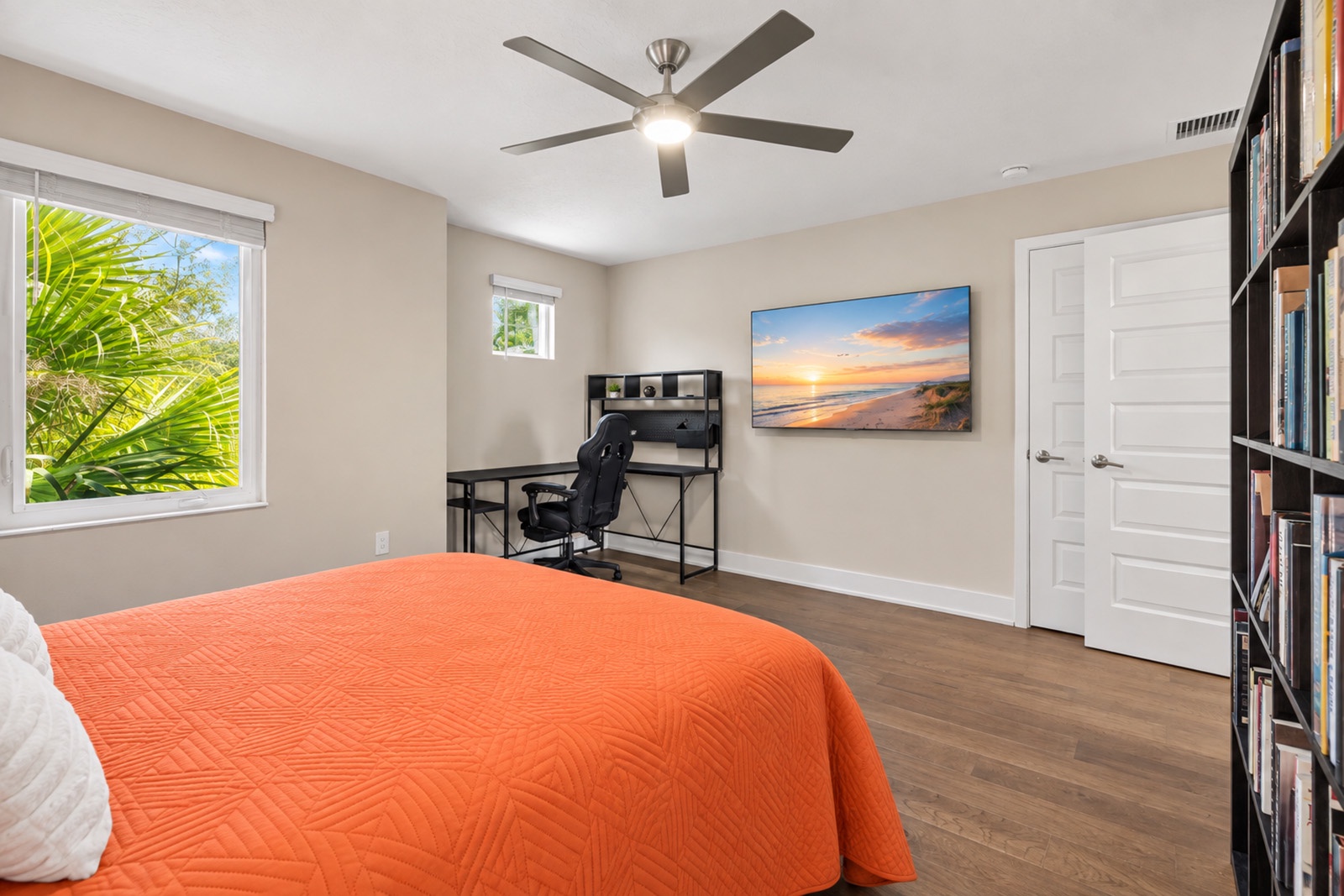 Unwind in your vibrant bedroom with hotel style linens and cozy queen bed. Bedroom includes a Smart TV, desk and gaming area.