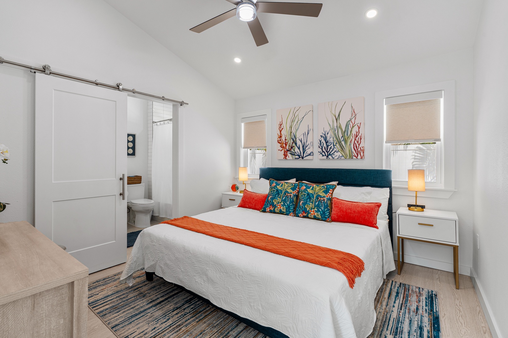 Unwind in your coastal-inspired bedroom, complete with a plush bed, charming decor, office desk area, and your own ensuite bathroom.
