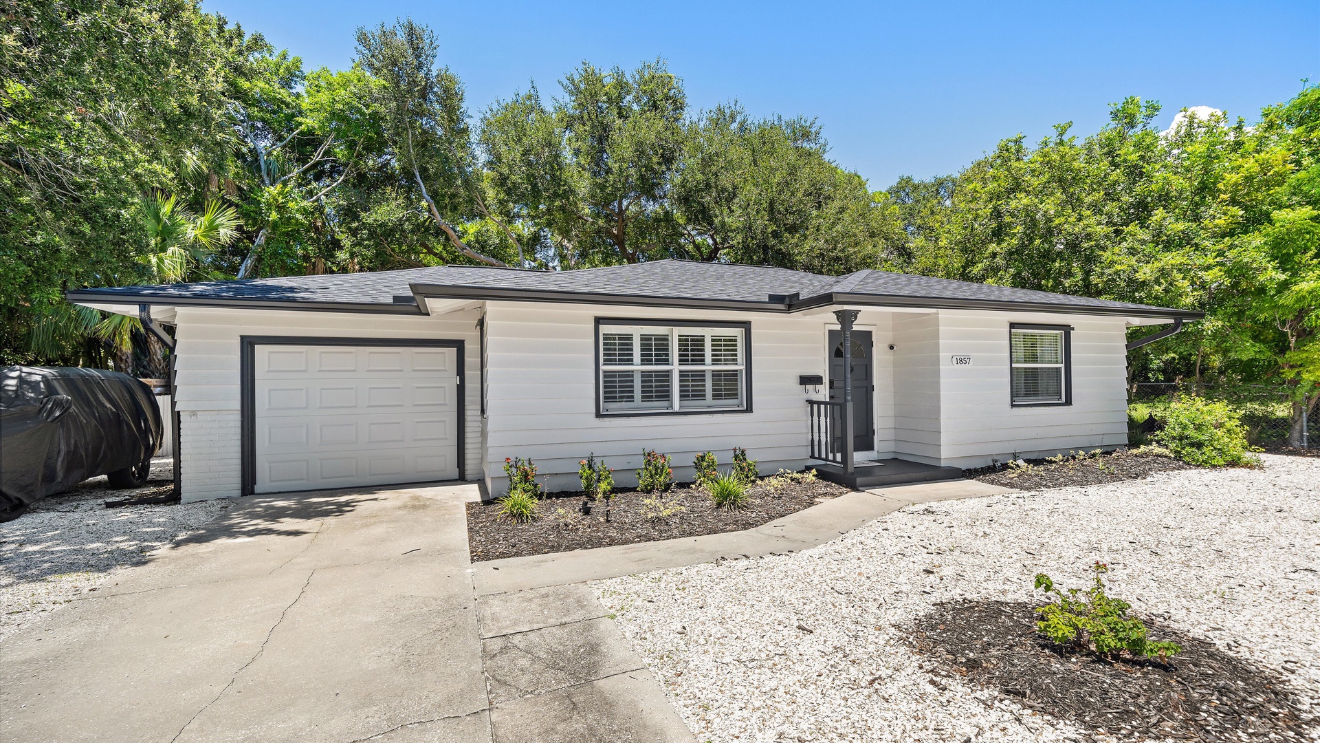 A freshly renovated home nestled among mature trees, offering a peaceful retreat with modern updates and a private driveway for your convenience.
