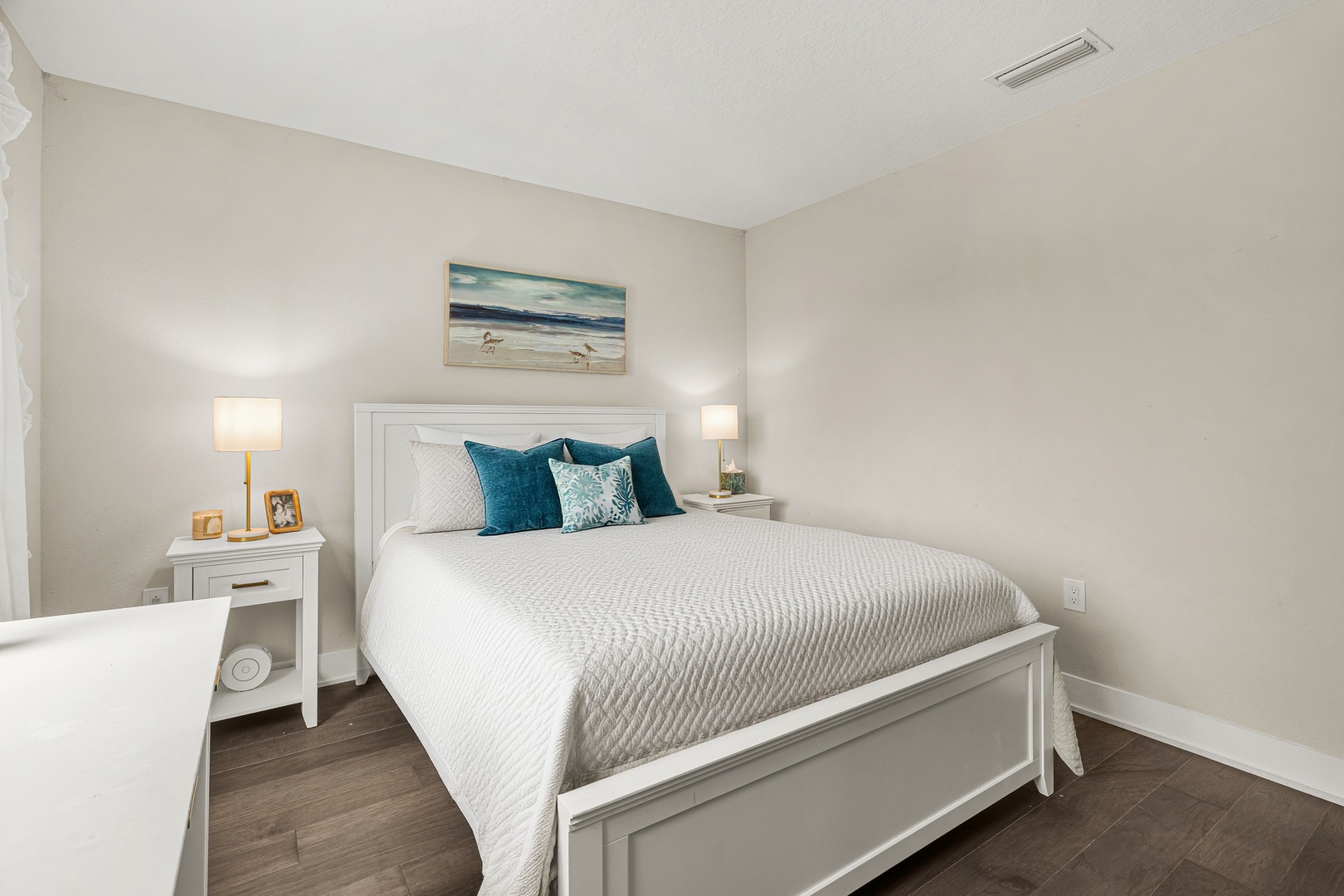 Unwind in this cozy queen bedroom with hotel-style linens, and Smart TV, overlooking Arlington Park.
