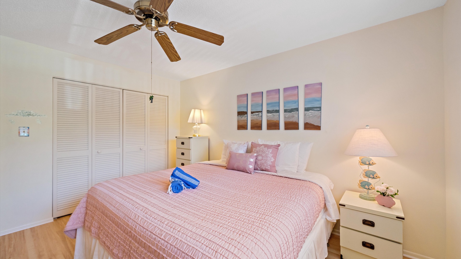 Unwind in your serene bedroom with soft coastal hues, a cozy queen bed, and gentle ceiling fan breeze—your perfect retreat after a day of sun and surf.