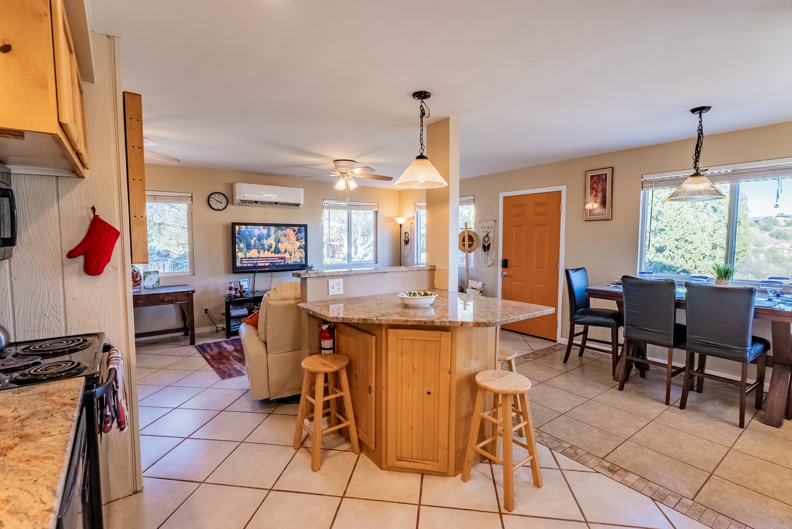 Gather around your spacious kitchen island with bar seating while staying connected to the open living and dining areas - perfect for meal prep and conversation.