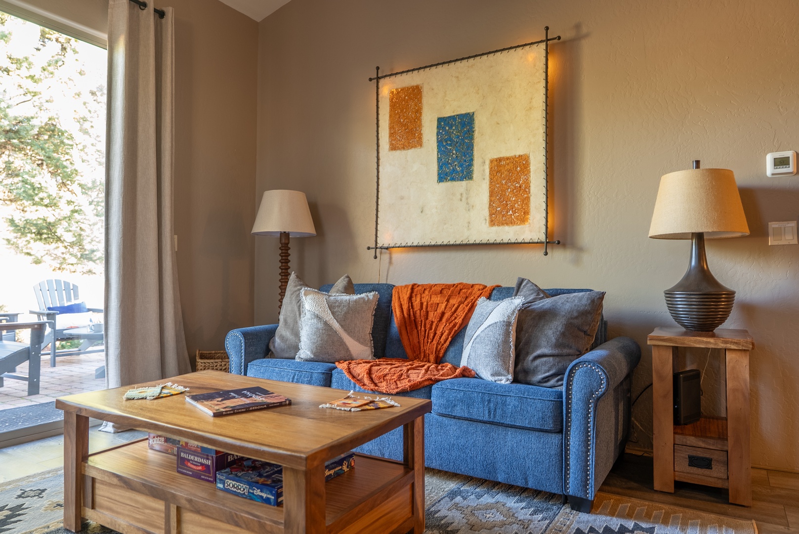 Sink into your cozy sofa with soft throws and pillows, perfect for unwinding.