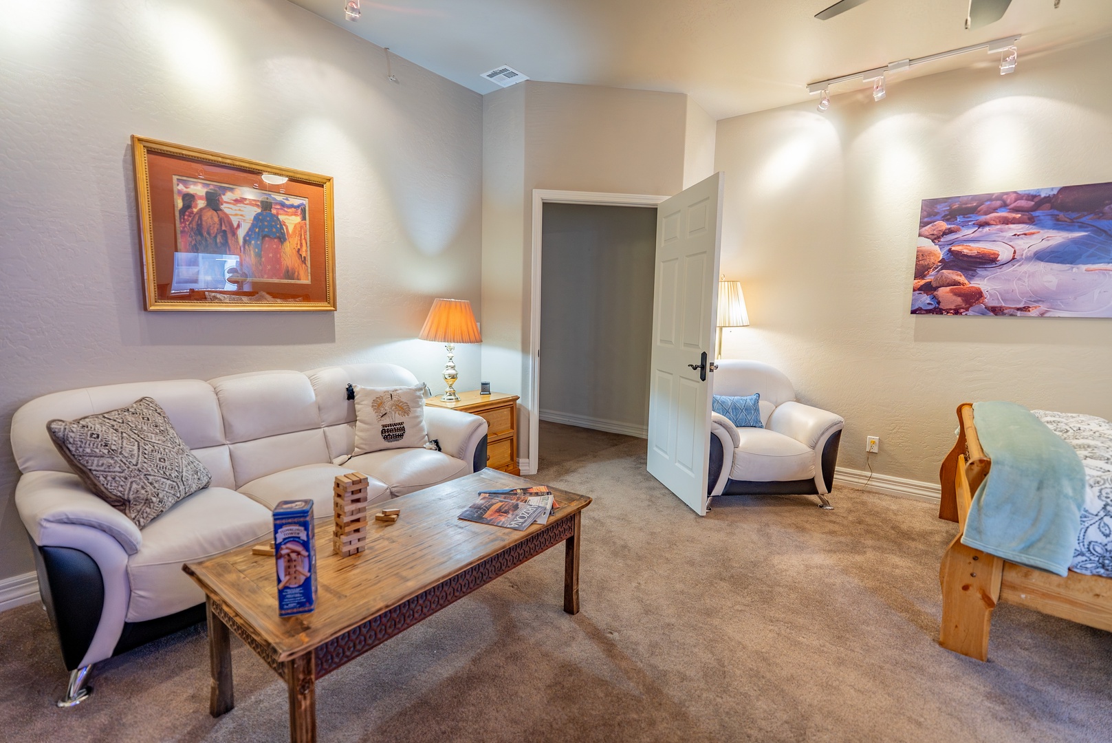 Unwind in your cozy living room with plush seating, warm lighting, and thoughtful touches that make you feel right at home.