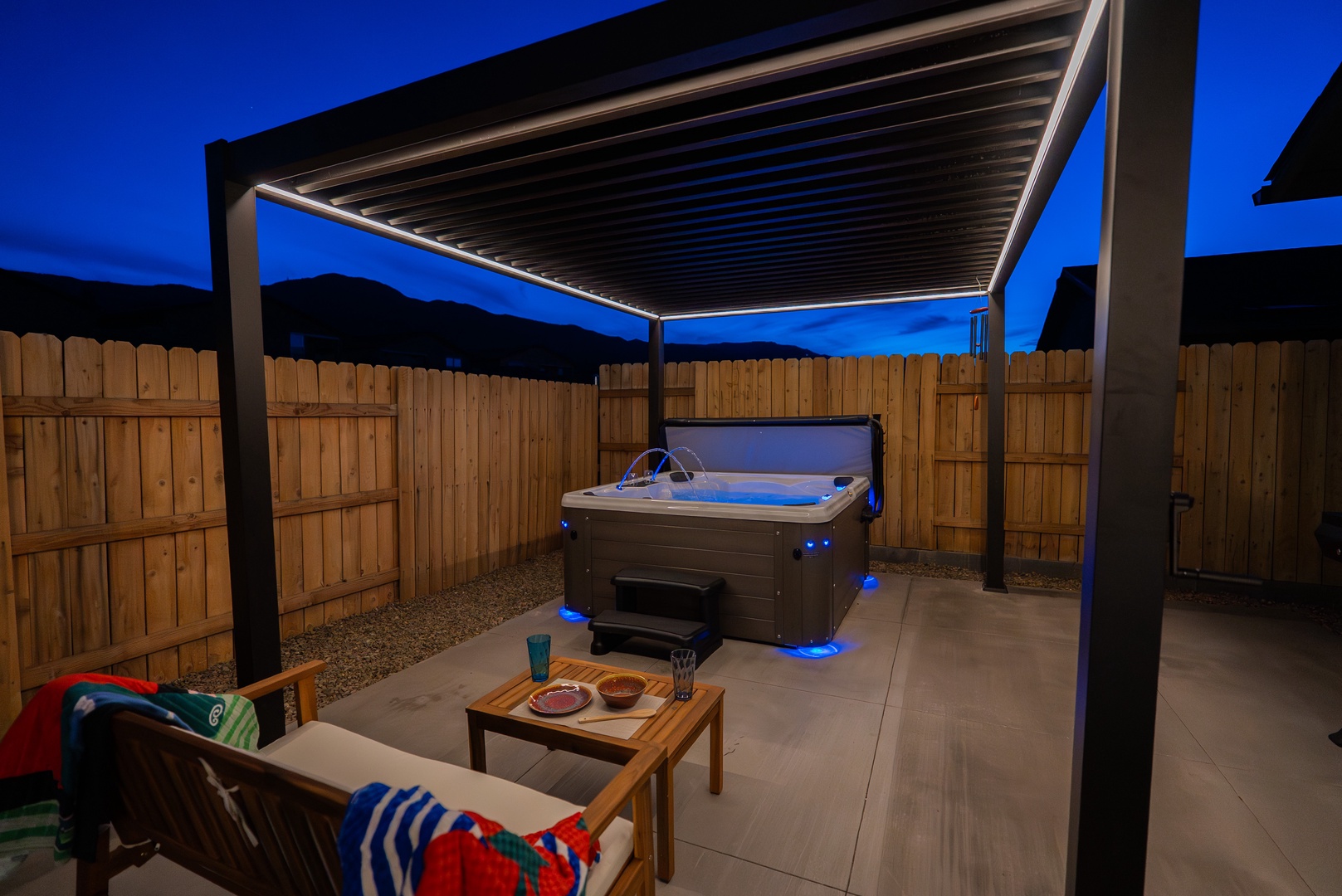 Unwind in your private hot tub under the starlit sky