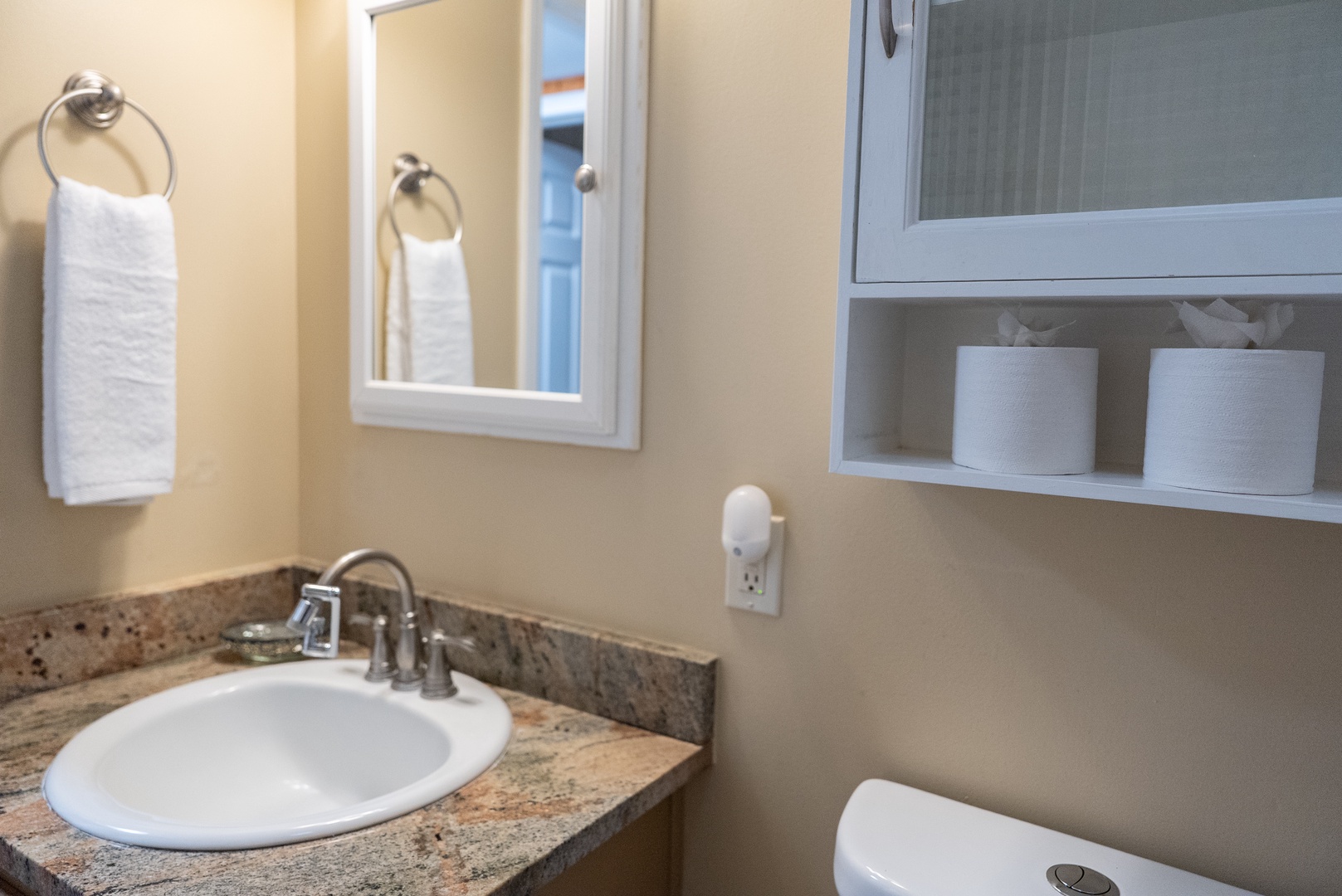 Your private bathroom features a granite vanity, convenient storage, and all the essentials for your comfort.