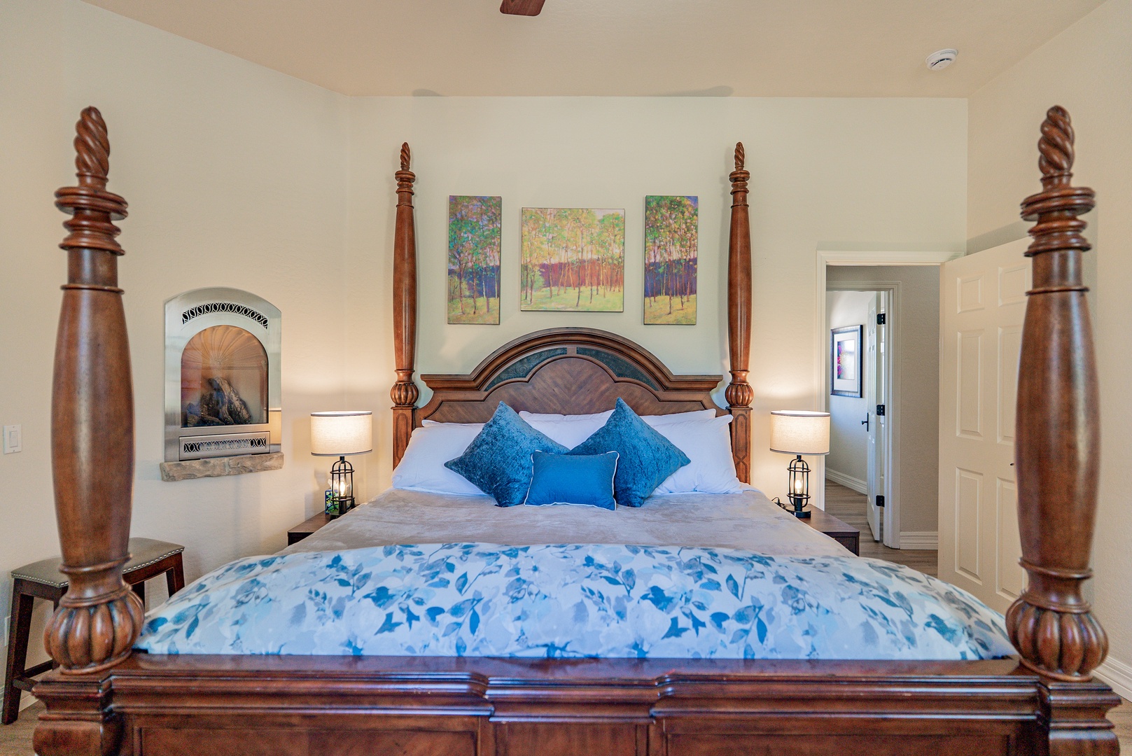 Sink into this stunning four-poster bed with luxurious linens and artwork that creates your perfect retreat.