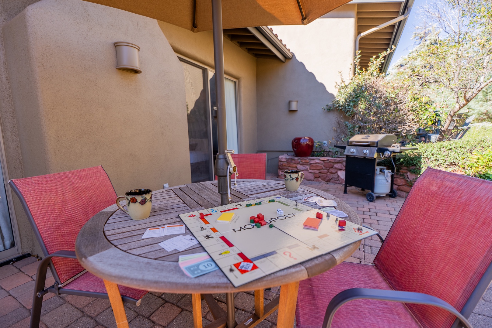 Your private patio awaits with a game of Monopoly ready to go, BBQ grill for outdoor cooking, and shade for relaxing afternoons.