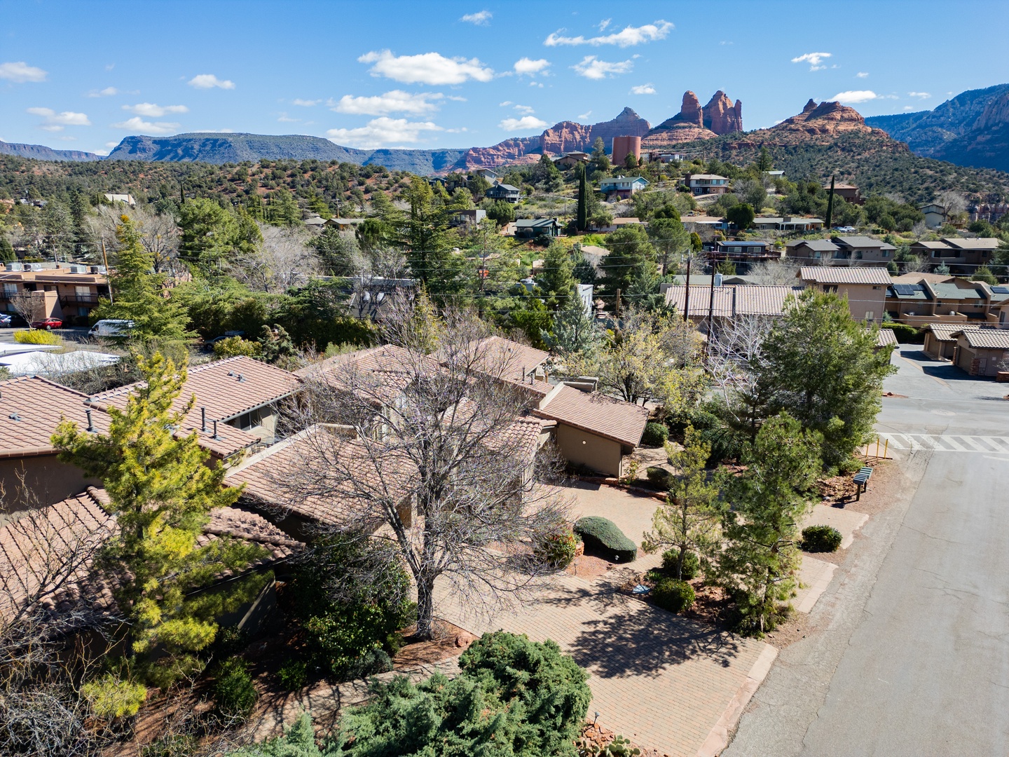 Spectacular aerial view of Sedona's red rock formations rising majestically beyond this charming residential neighborhood.