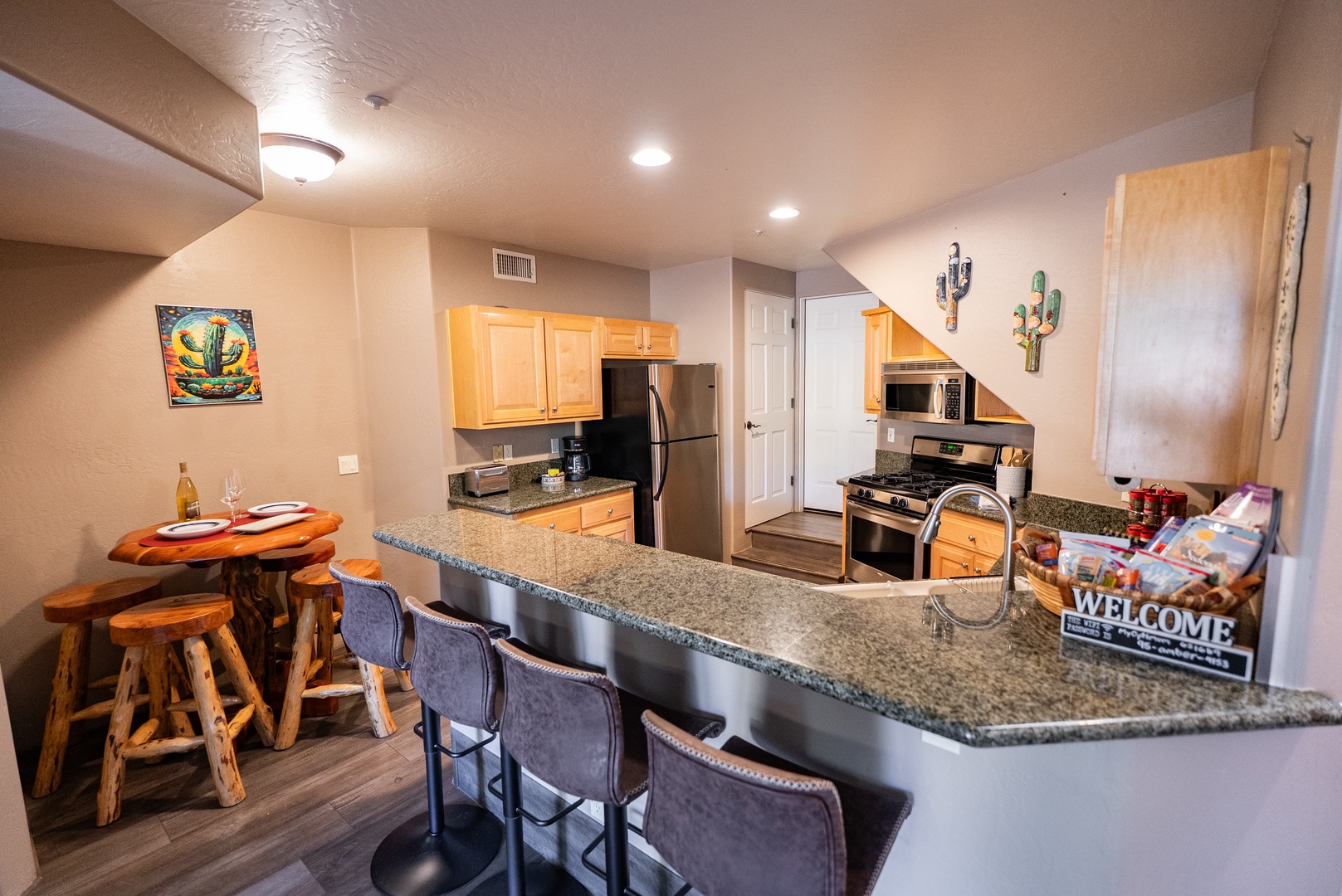 Your fully equipped kitchen awaits with granite counters, modern appliances, and cozy breakfast bar seating for memorable meals together.