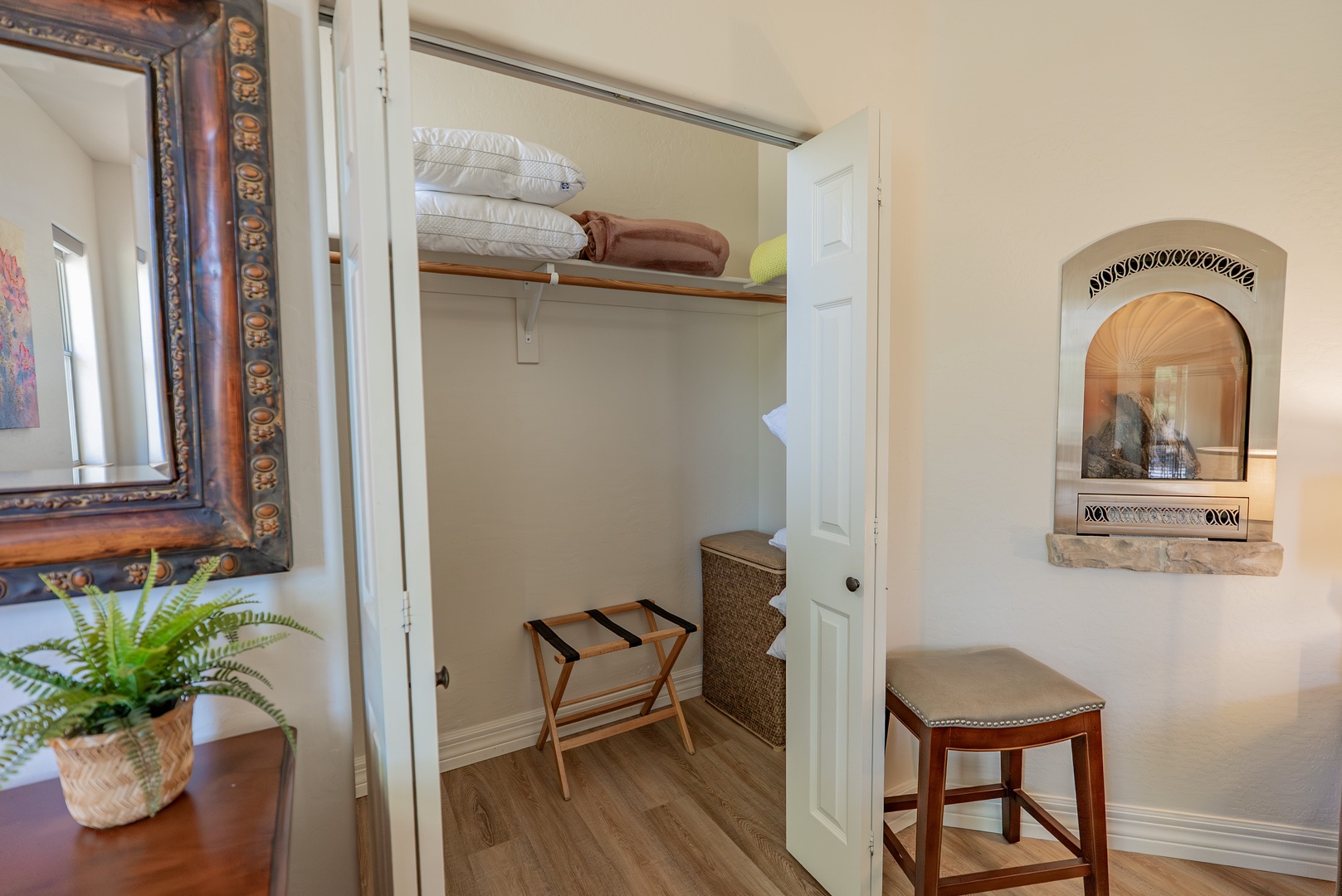 Your spacious walk-in closet features thoughtful details like extra blankets, a luggage rack, and organized storage to keep your belongings perfectly arranged.