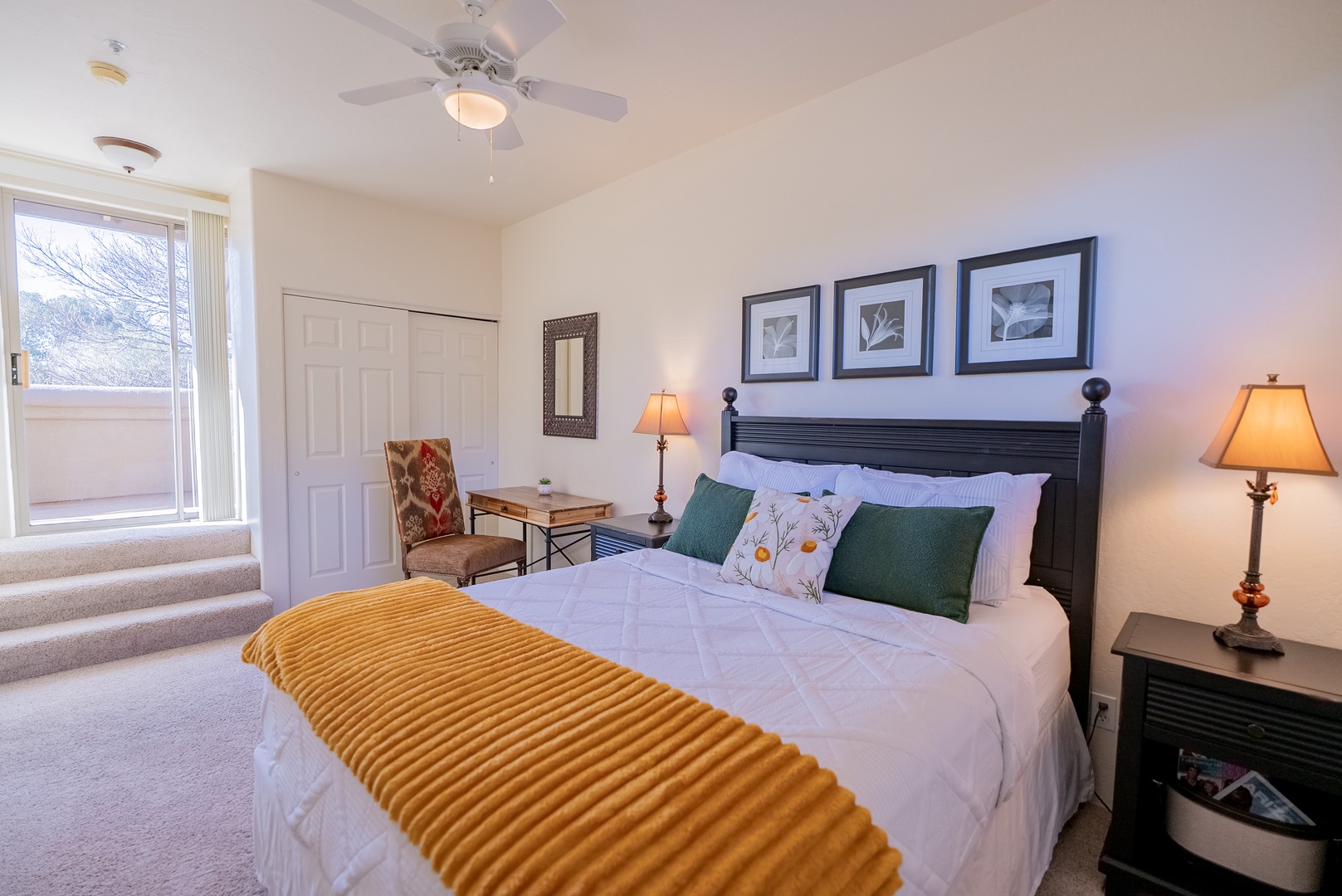 Unwind in your comfortable bedroom with plush linens, warm lighting, and peaceful views through large windows.
