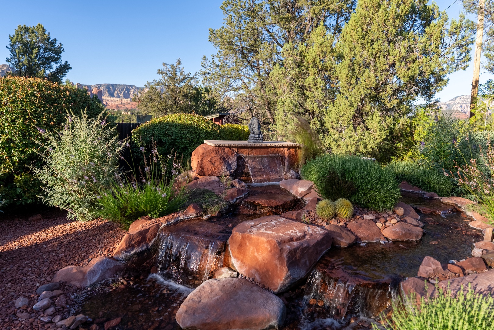 Tranquil water feature creates a relaxing sound day or night.