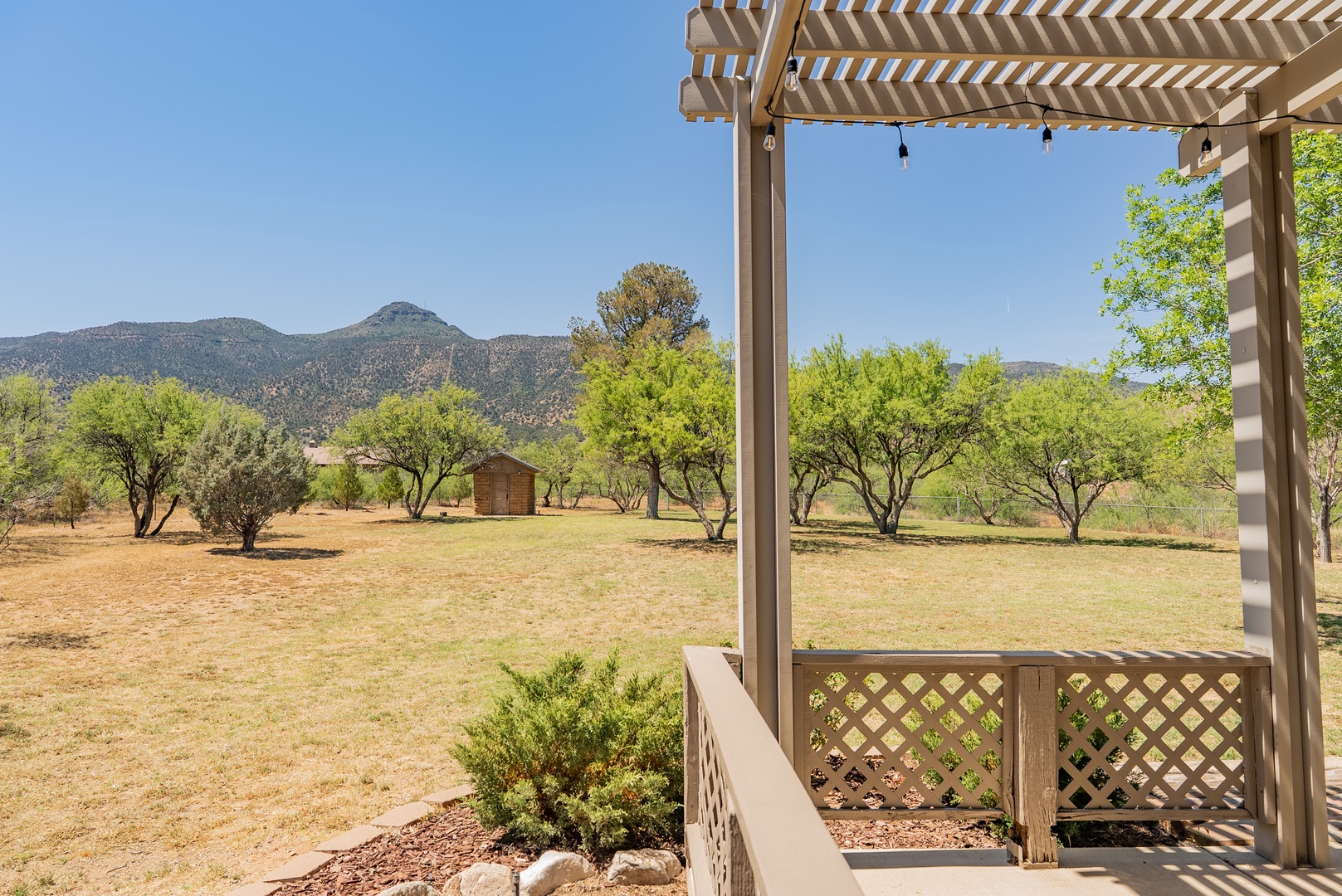 Expansive mountain views from peaceful outdoor deck area.