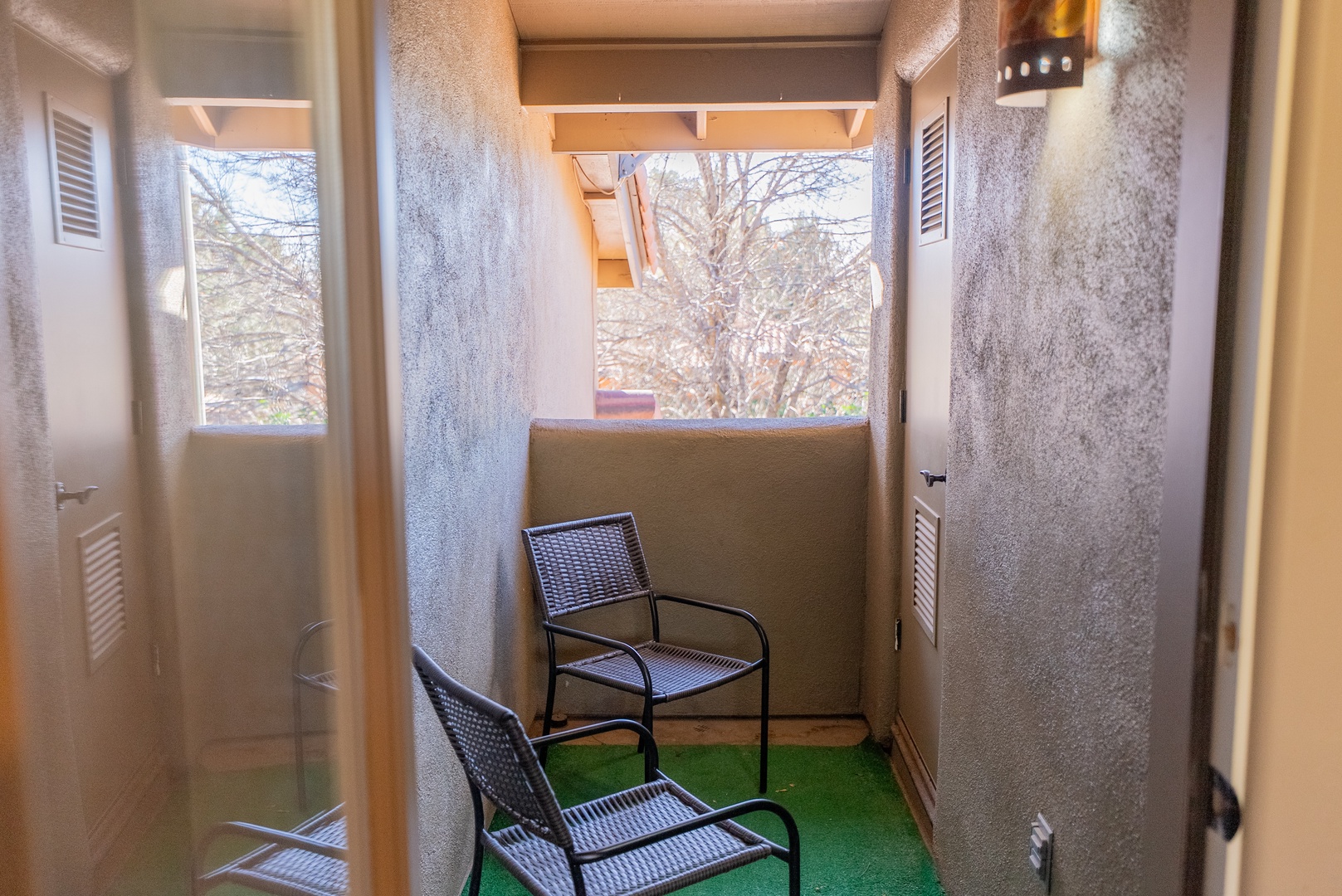 Your private balcony awaits with comfortable seating and lovely garden views for peaceful morning coffee or evening relaxation.