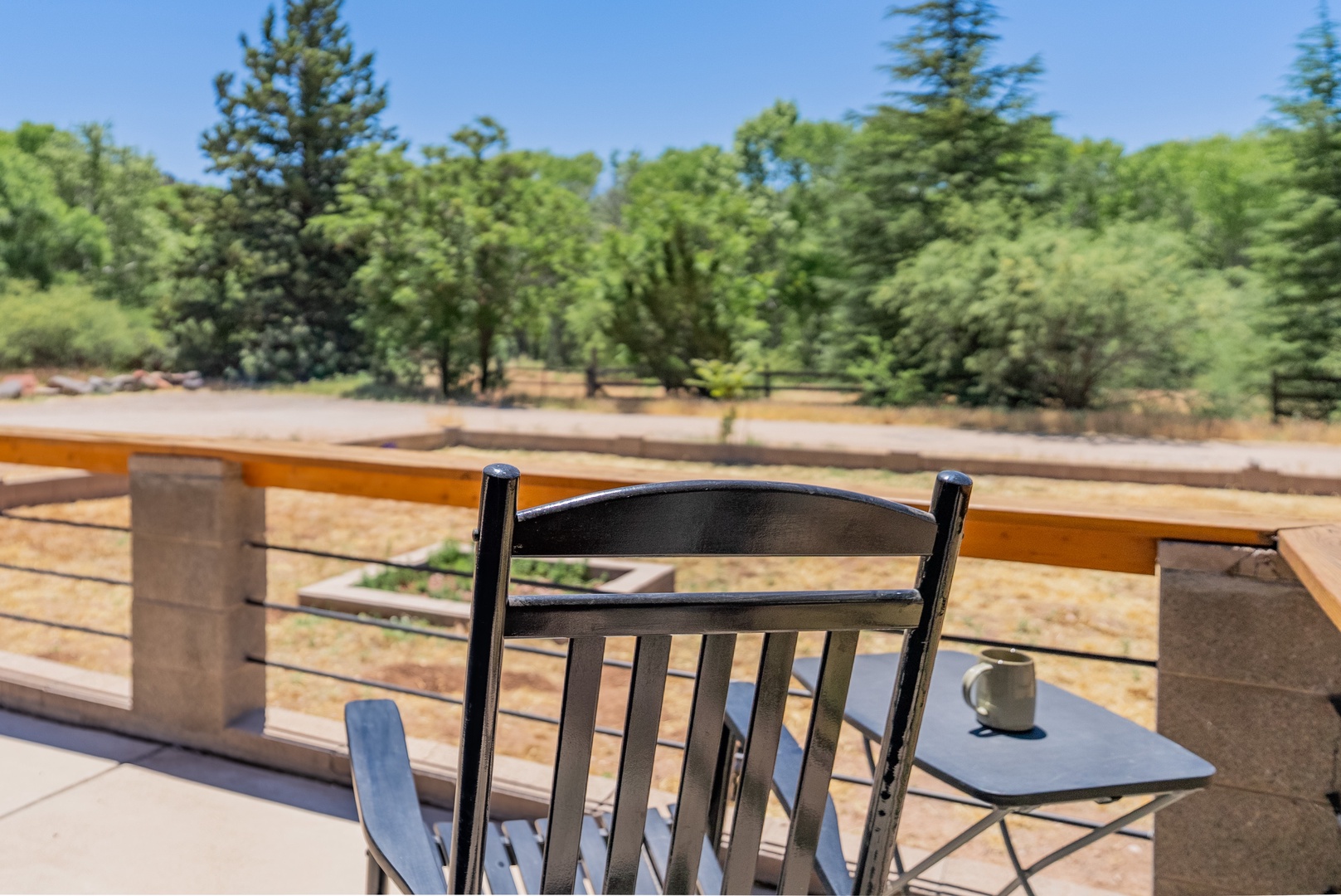 Front porch rocking chair and space heater faces river access