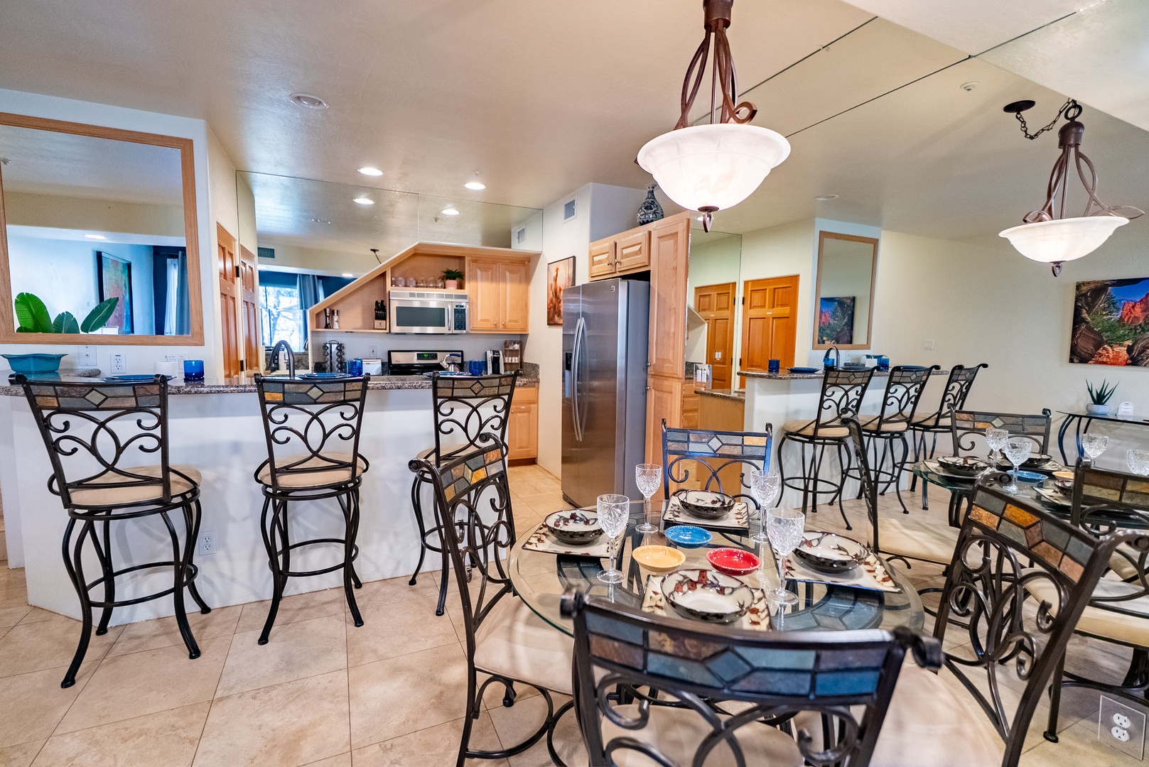 Gather around your elegant glass dining table and cook together in the fully equipped kitchen with modern appliances and granite countertops.